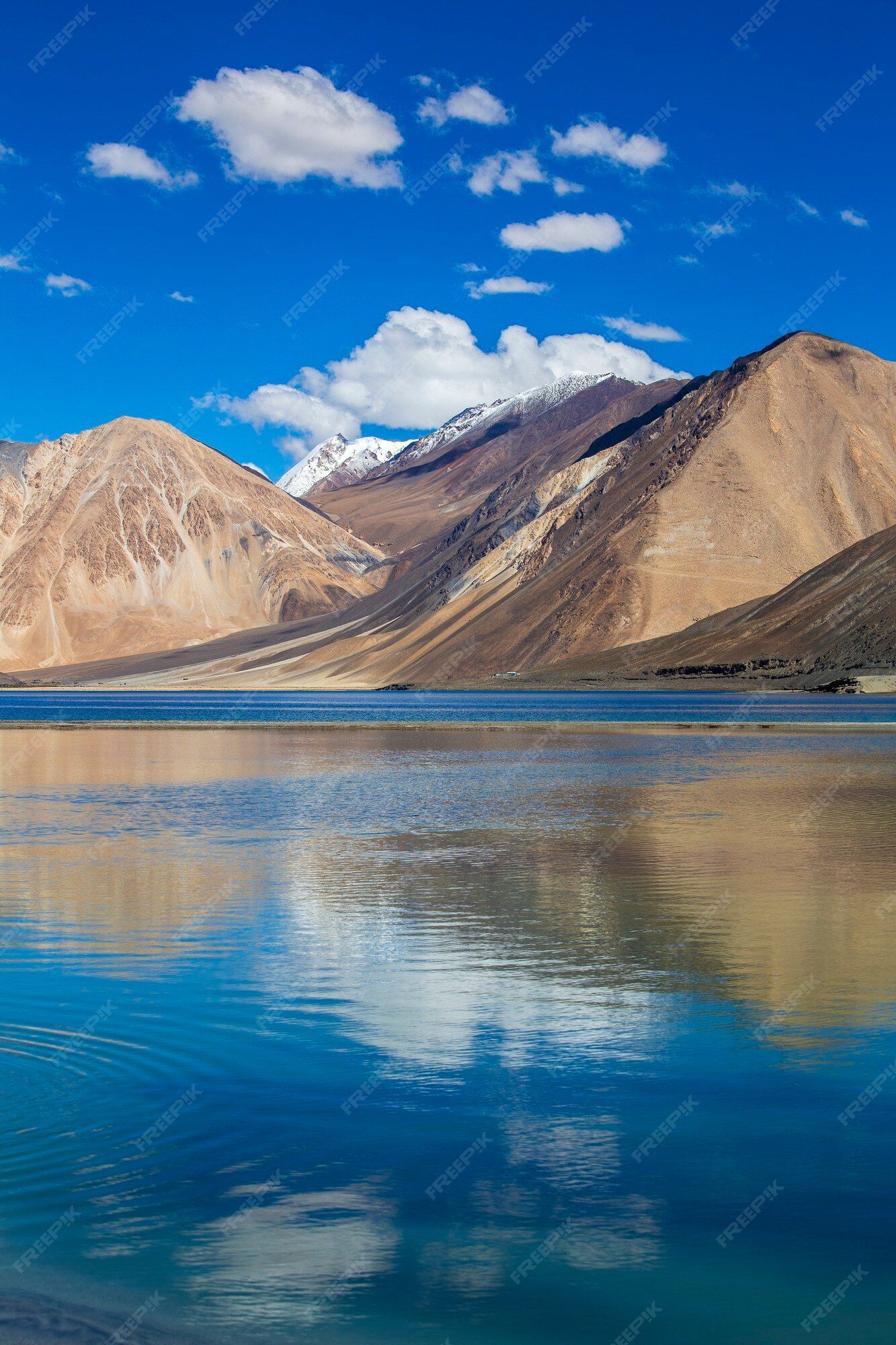 1333x2000 Premium Photo. View of majestic rocky mountains against the blue sky and lake pangong in indian himalayas, ladakh region, jammu and kashmir, india. nature and travel concept
