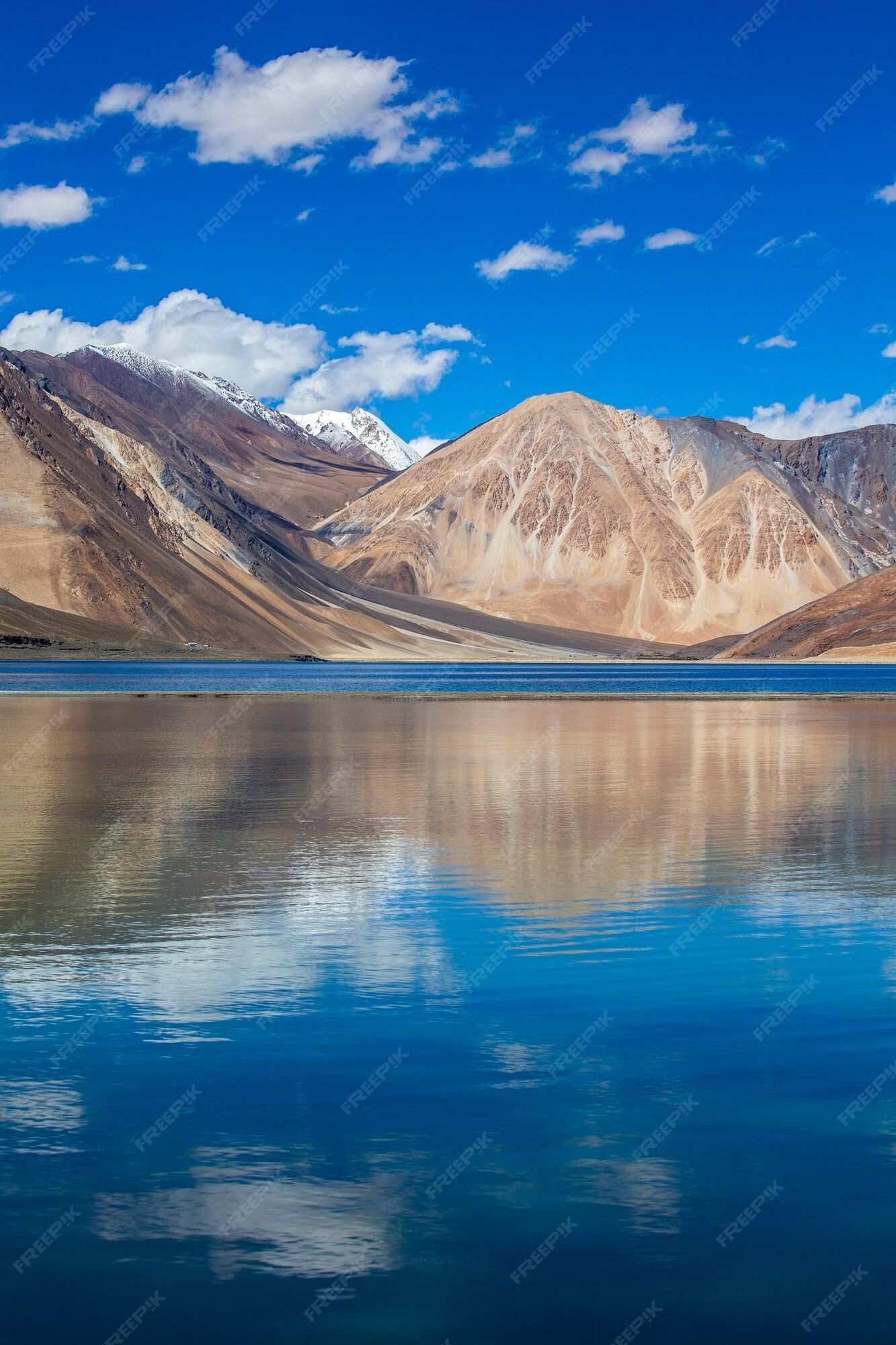 1333x2000 Premium Photo. View of majestic rocky mountains against the blue sky and lake pangong in indian himalayas, ladakh region, jammu and kashmir, india. nature and travel concept