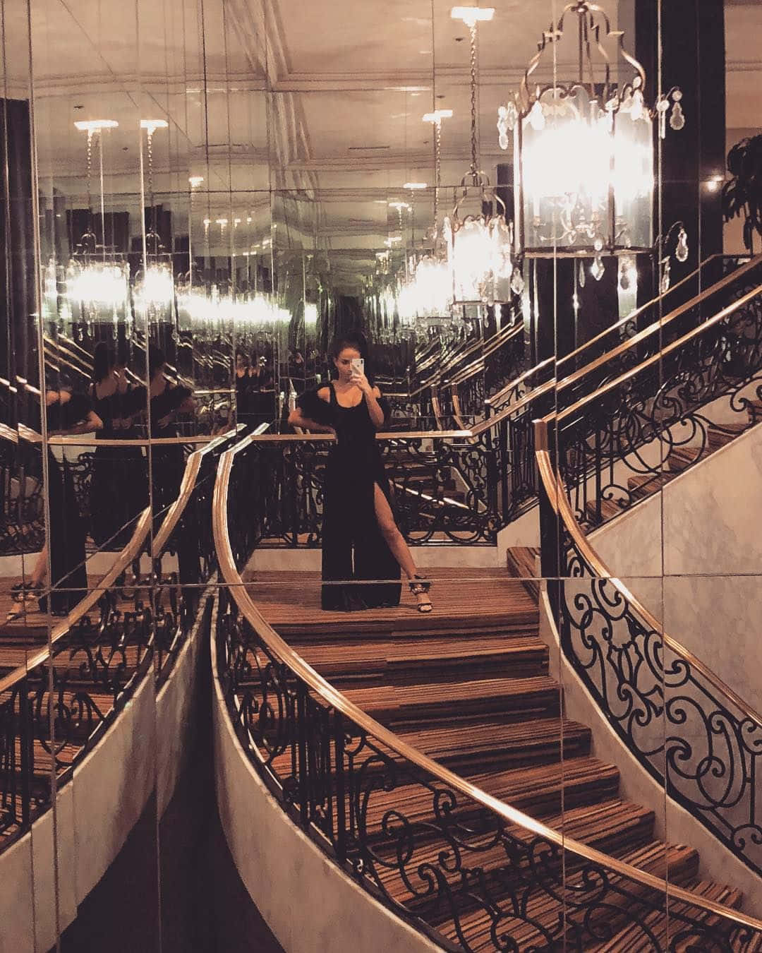1080x1350 Download A Woman Standing On A Staircase Wallpaper