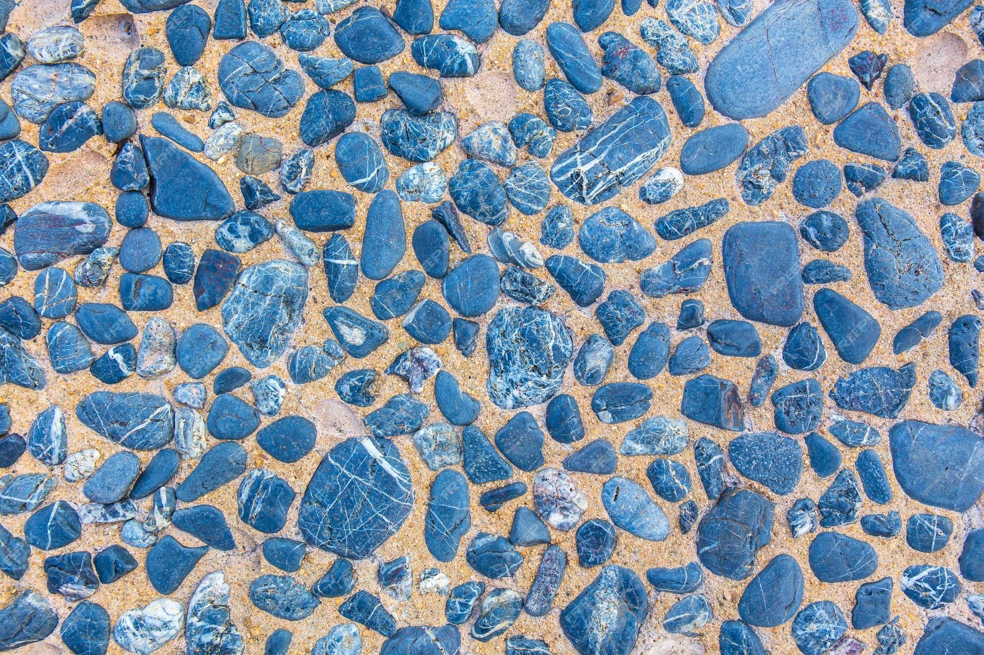 2000x1333 Premium Photo. Abstract stone floor for background or skin wall tiles wallpaper sea stones background natural stone for decoration picture backdrop texture