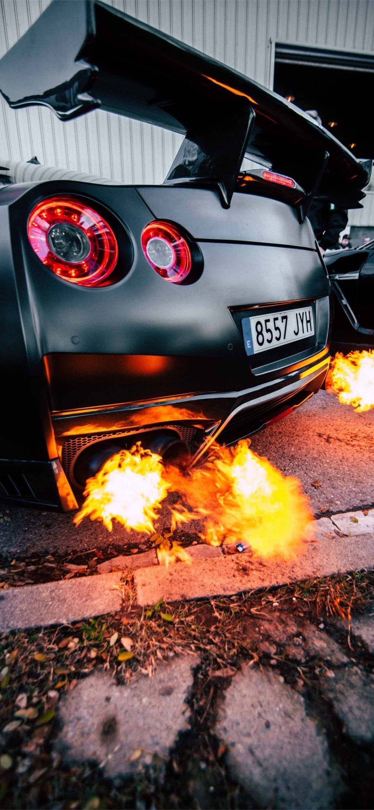 1284x2778 Black Nissan GTR Exhaust Wallpaper Download