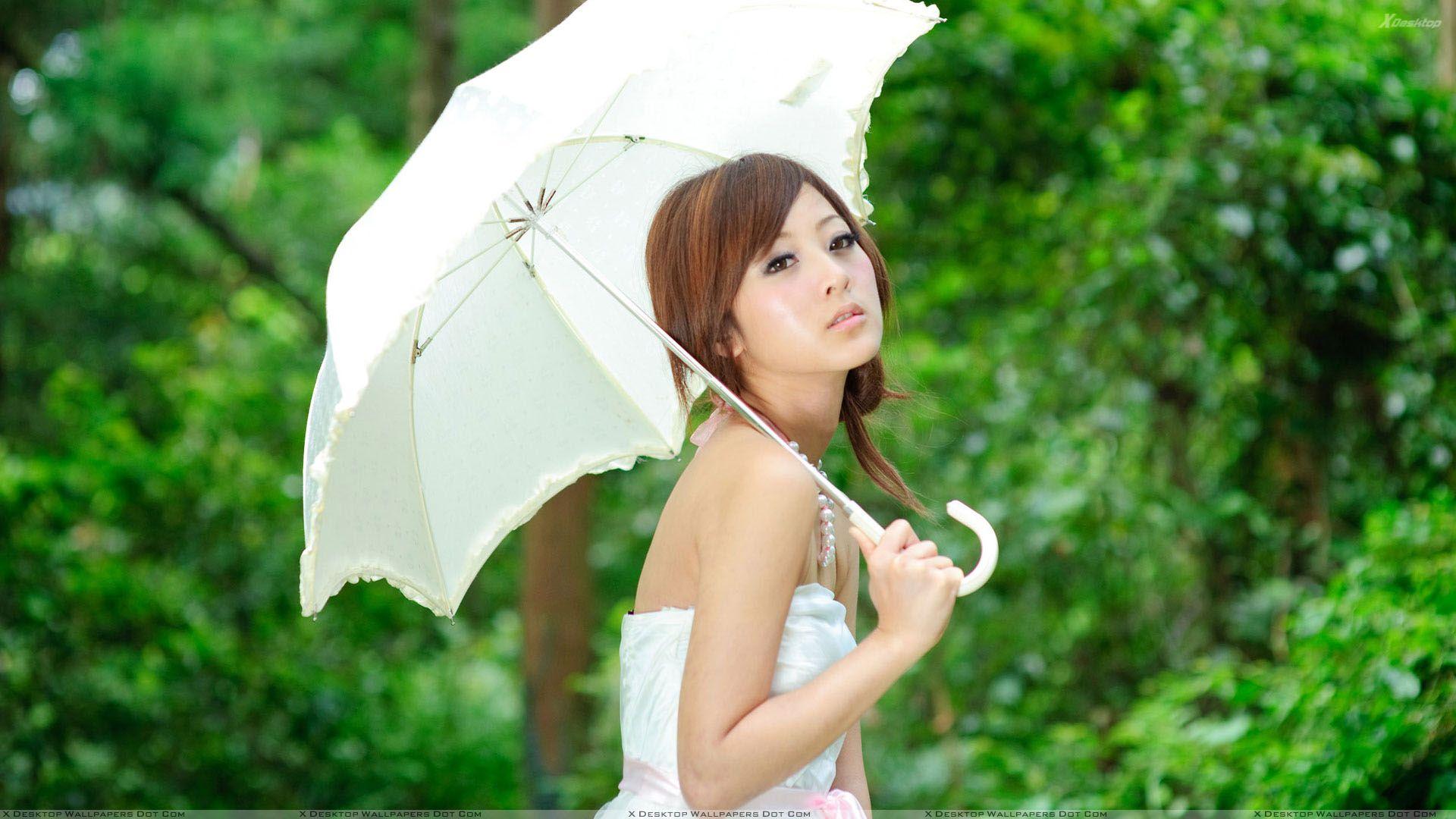 1920x1080 Asian Girl Thinking With White Umbrella in Green Garden Wallpaper