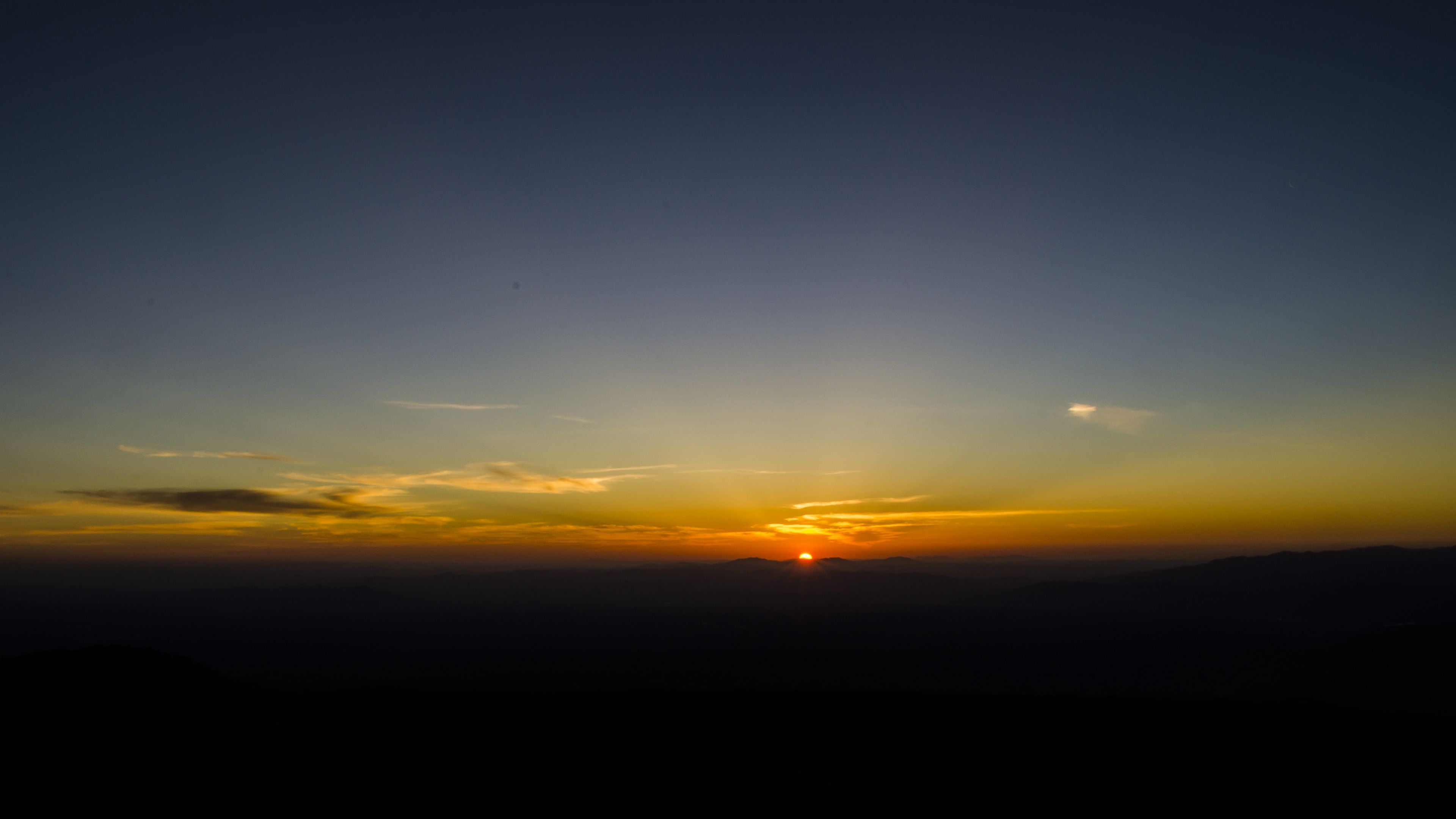 3840x2160 Download wallpaper 3840x2160 dawn, horizon, mountains, sun, sky, dark, sunrise 4k uhd 16:9 HD background