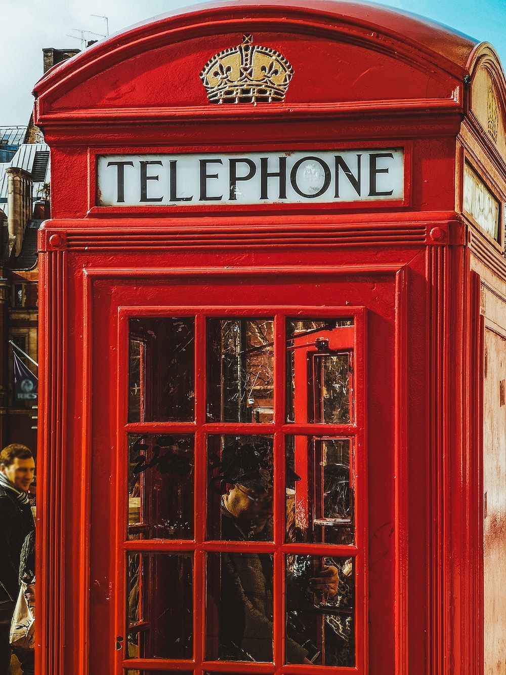 1000x1333 Person inside red telephone booth during daytime photo