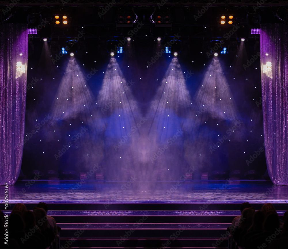 1000x865 An empty stage of the theater, lit by spotlights and smoke before the performance
