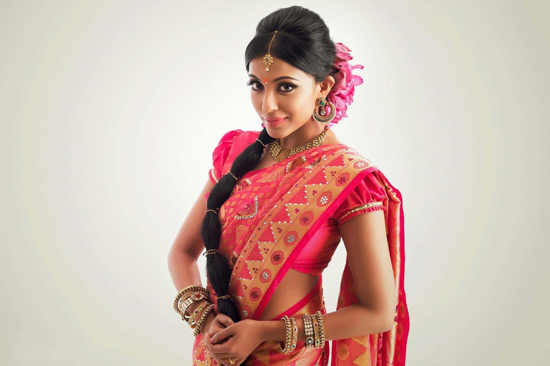 1920x1280 Download Elegant Indian Woman with Captivating Brown Eyes in a Pink Sari Wallpaper