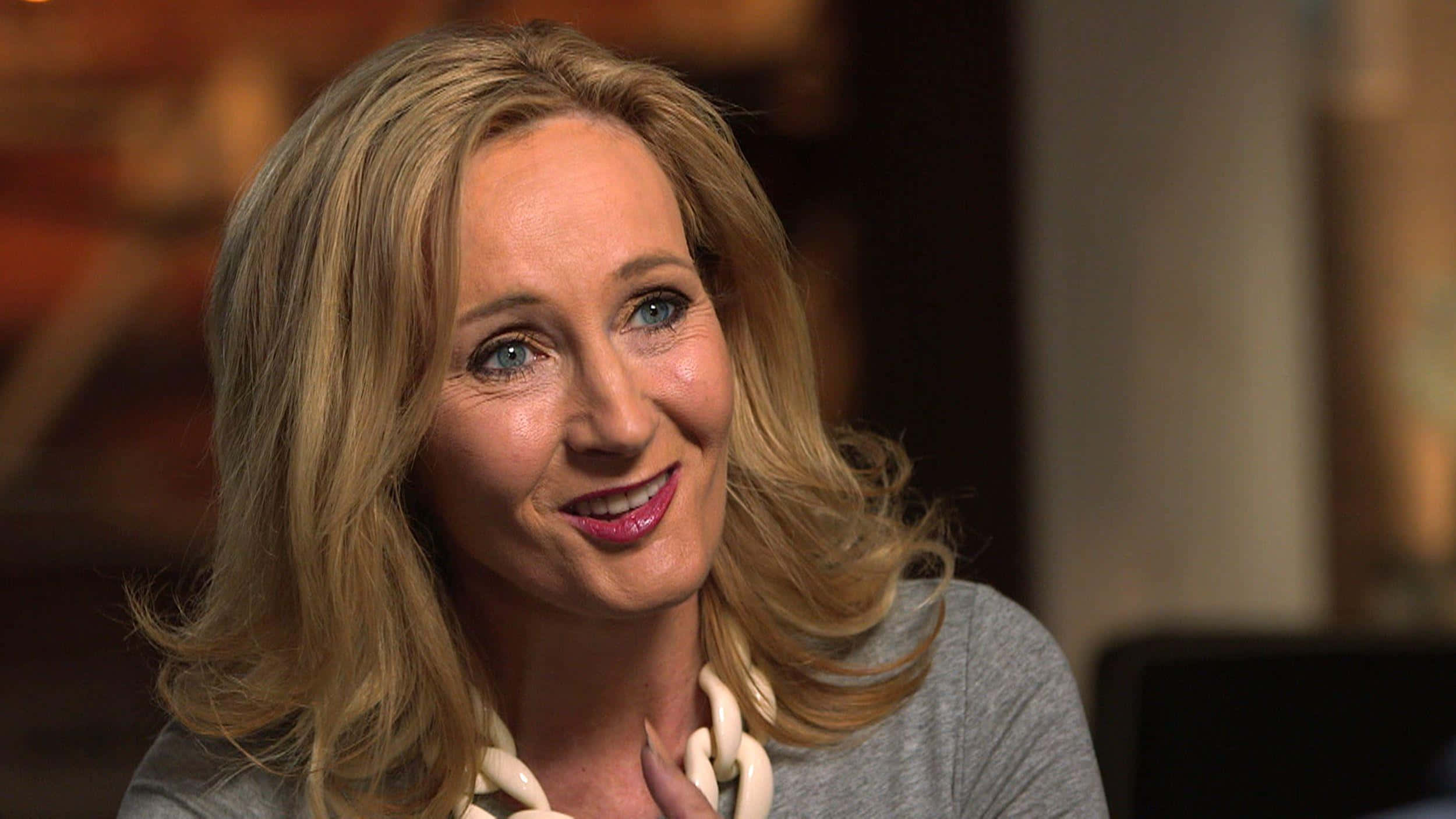 2500x1407 Download J.K. Rowling Smiling at a Book Event Wallpaper