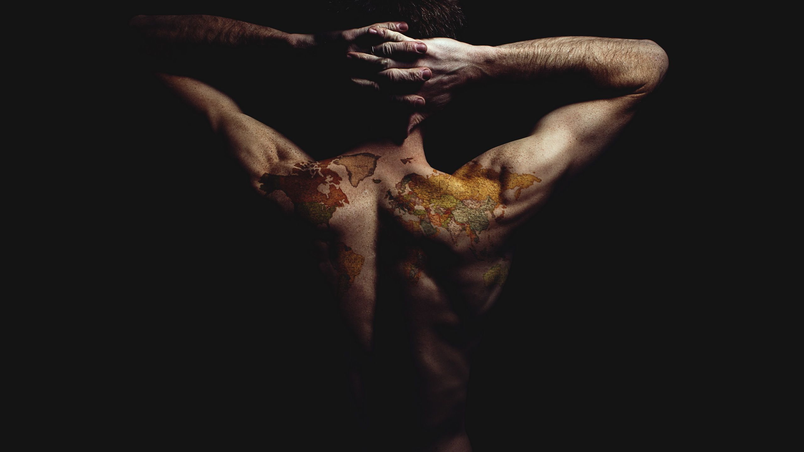 2560x1440 Download wallpaper man, tattoo, the world has my back, section men in resolution 2560x1440