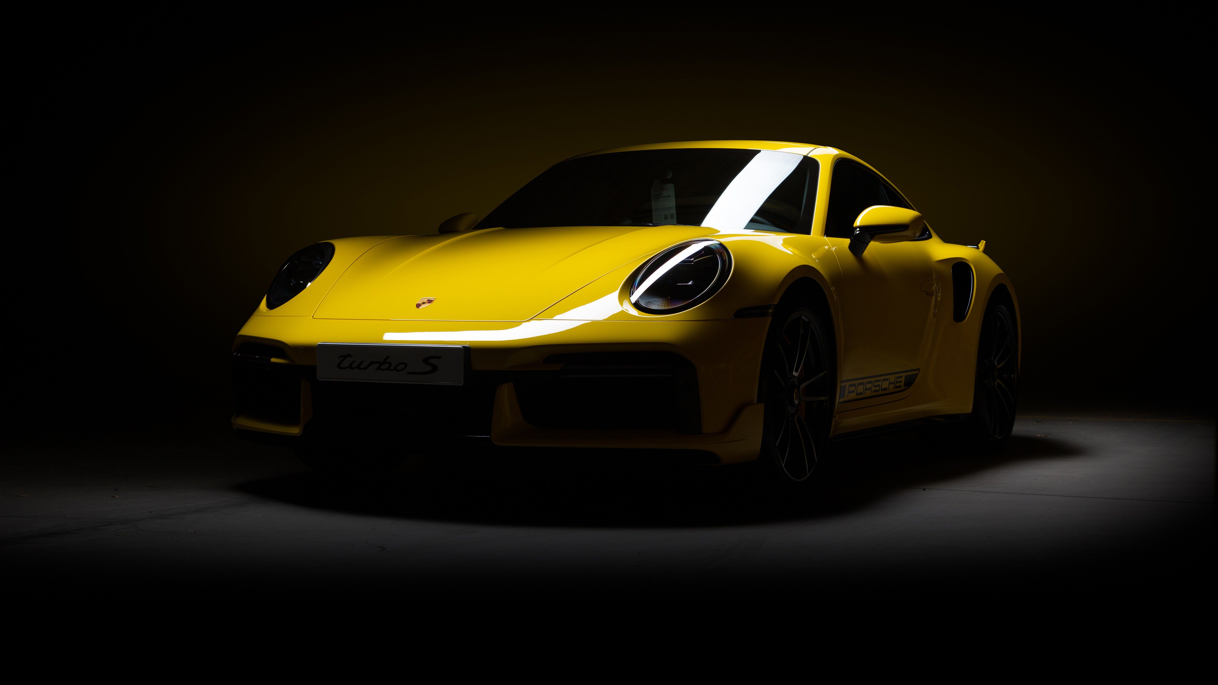 5120x2880 Porsche 911 Turbo S Yellow Car Dark Background 4K 5K HD Cars Wallpaper
