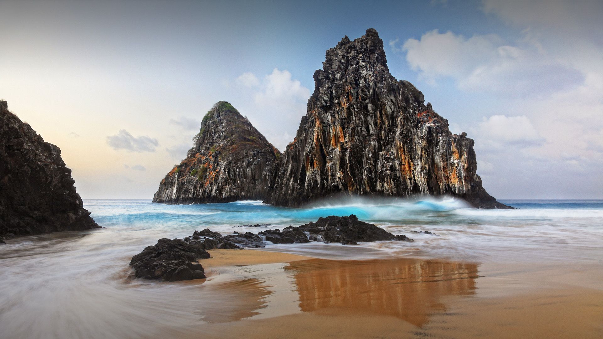 1920x1080 Twin rocks (Dois Irmaos) on Cacimba Do Padre beach, Fernando de Noronha, Pernambuco, Brazil. Windows Spotlight Image