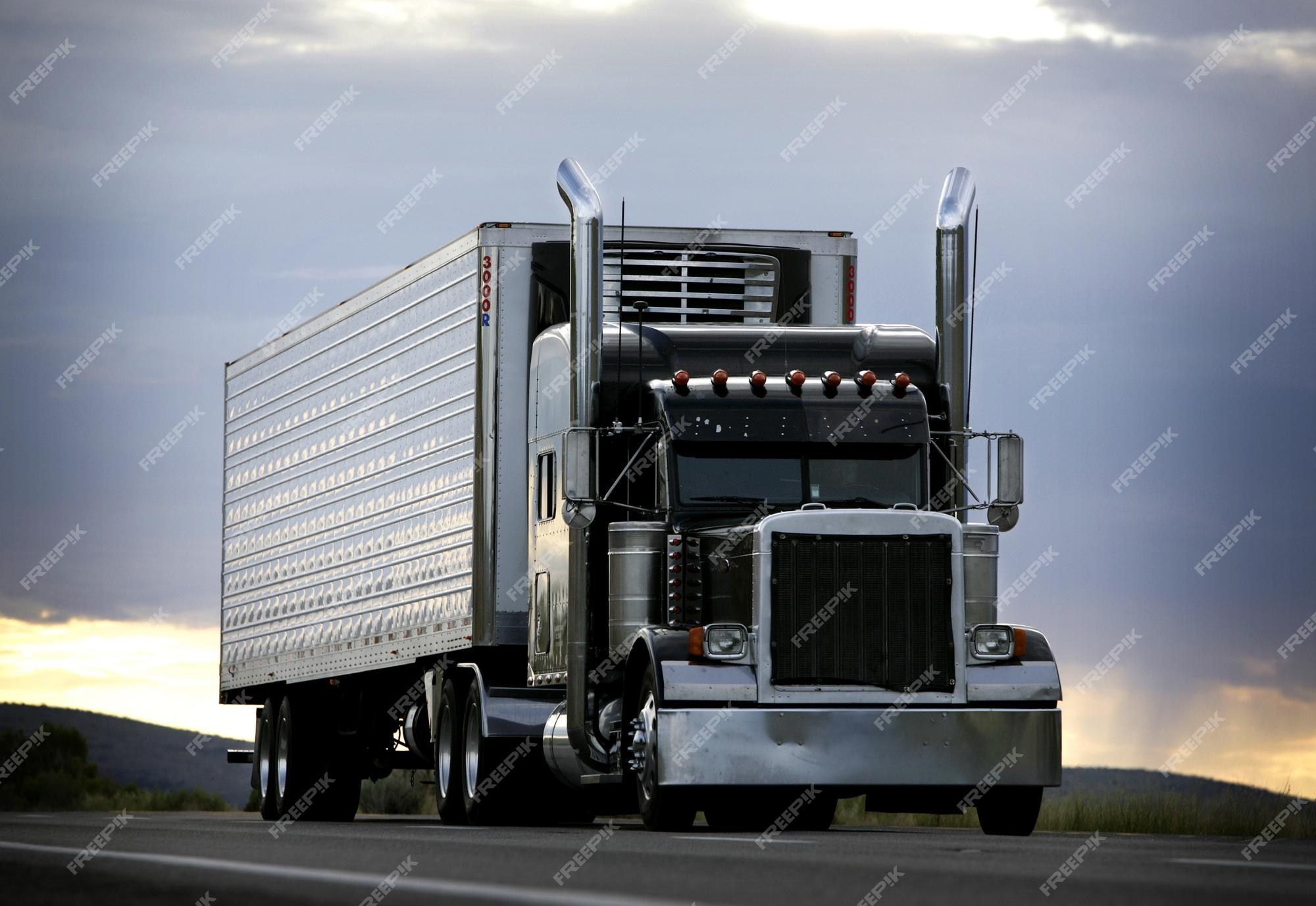 2000x1378 Premium Photo. Big truck driving on a