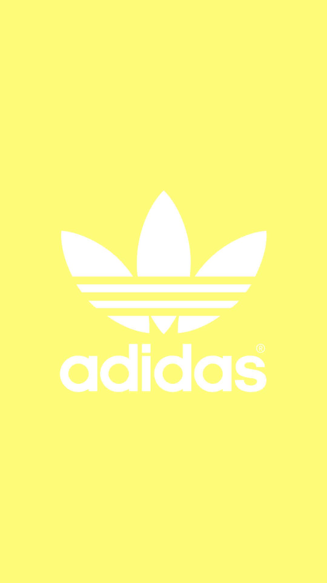 yellow adidas logo