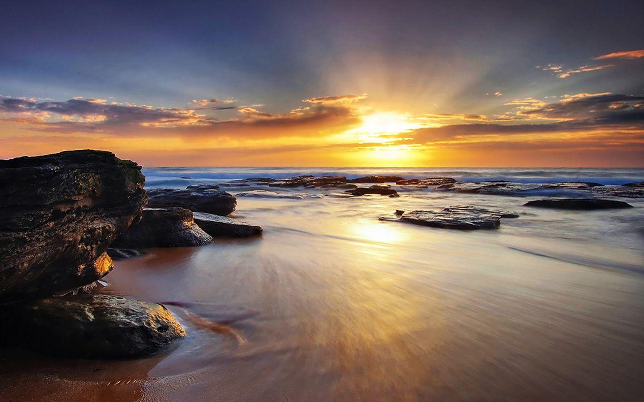 Hình ảnh bình minh trên bãi biển 1280x800 https://wallpaperaccess.com/full/1194223.jpg