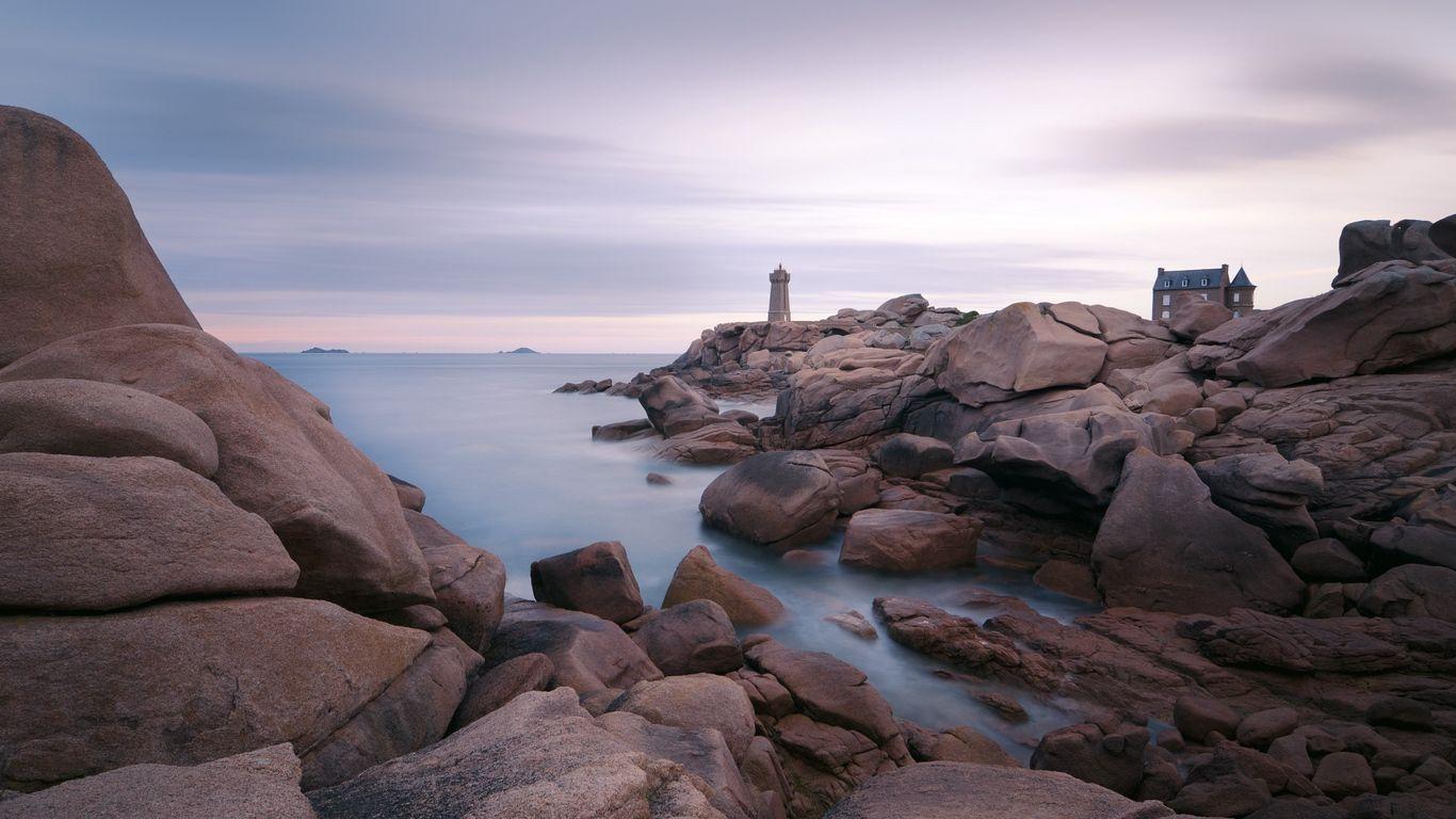 1366x768 Download wallpaper 1366x768 lighthouse, stones, sea, rocks
