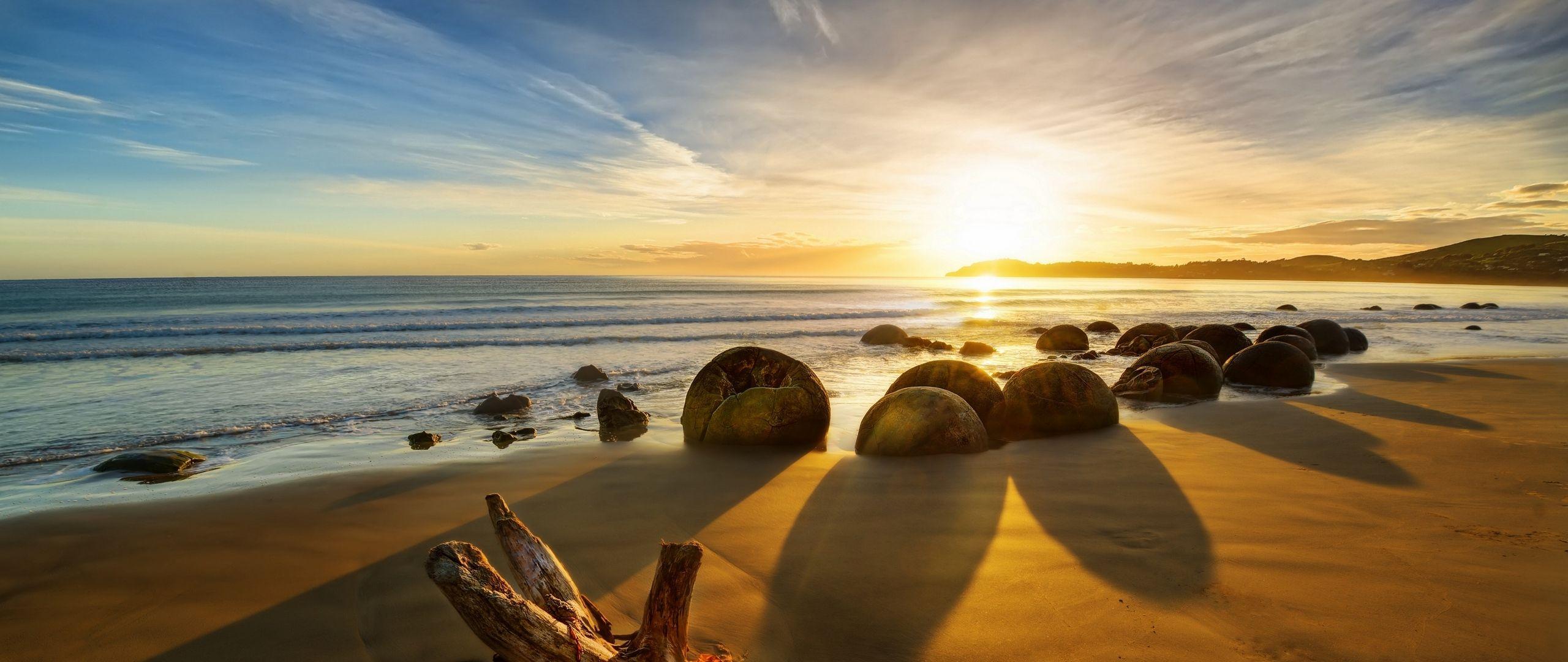 2560x1080 Download wallpaper 2560x1080 new zealand, ocean, sunrise