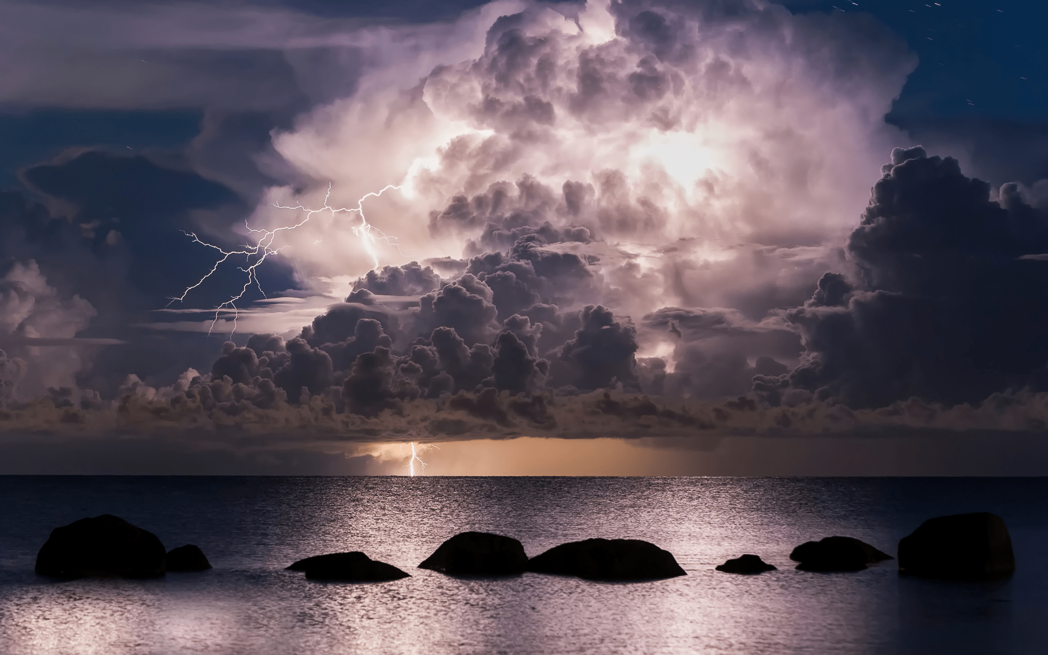 2048x1280 Lightning and Storm Clouds over Ocean