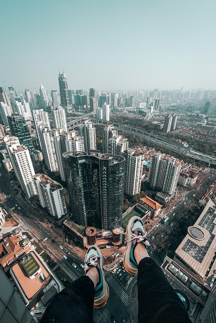 728x1090 HD wallpaper: multicolored Balenciaga shoes, feet, roof, skyscrapers, freedom