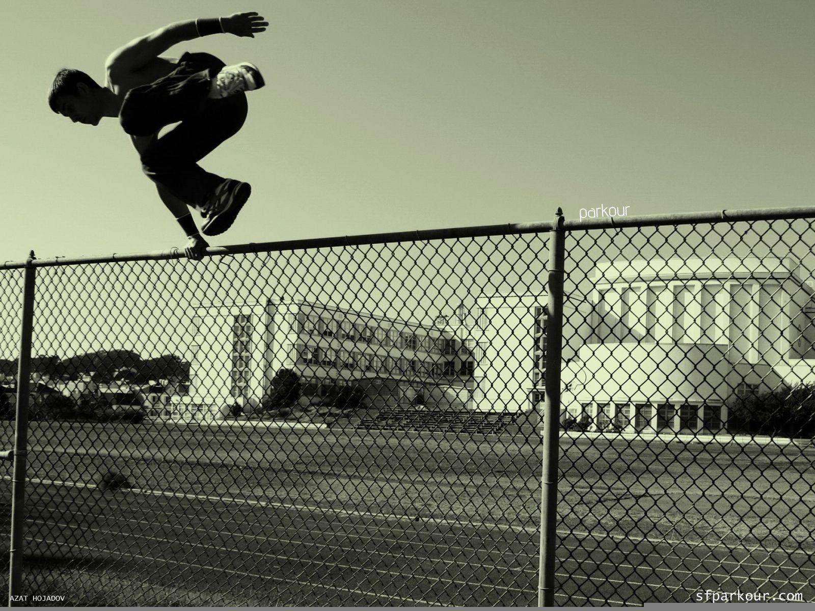 1600x1200 Parkurschik jumping over the fence wallpaper and image
