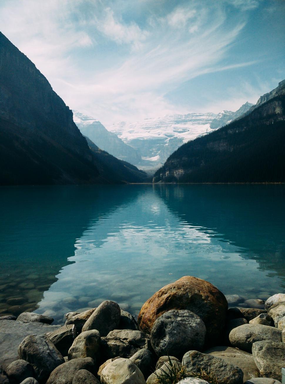 970x1308 Free of Placid lake in mountains with reflections. Download Free Image and Free Illustrations