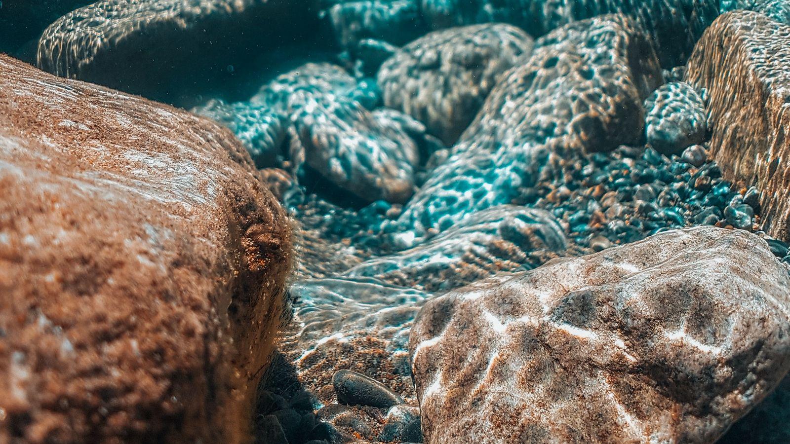 1600x900 Download wallpaper 1600x900 ocean, stones, underwater world