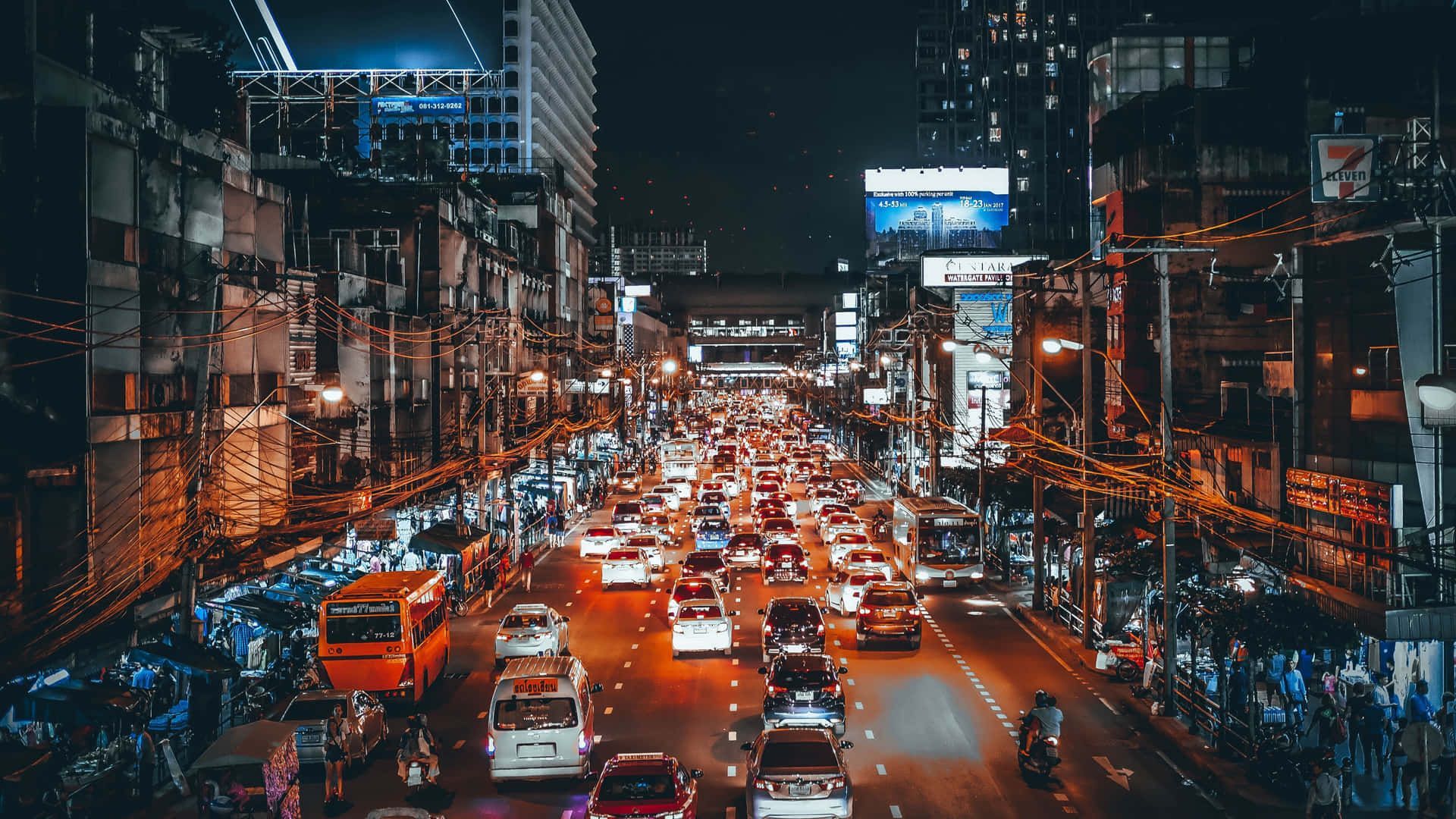 1920x1080 Busy City Street at Night Wallpaper