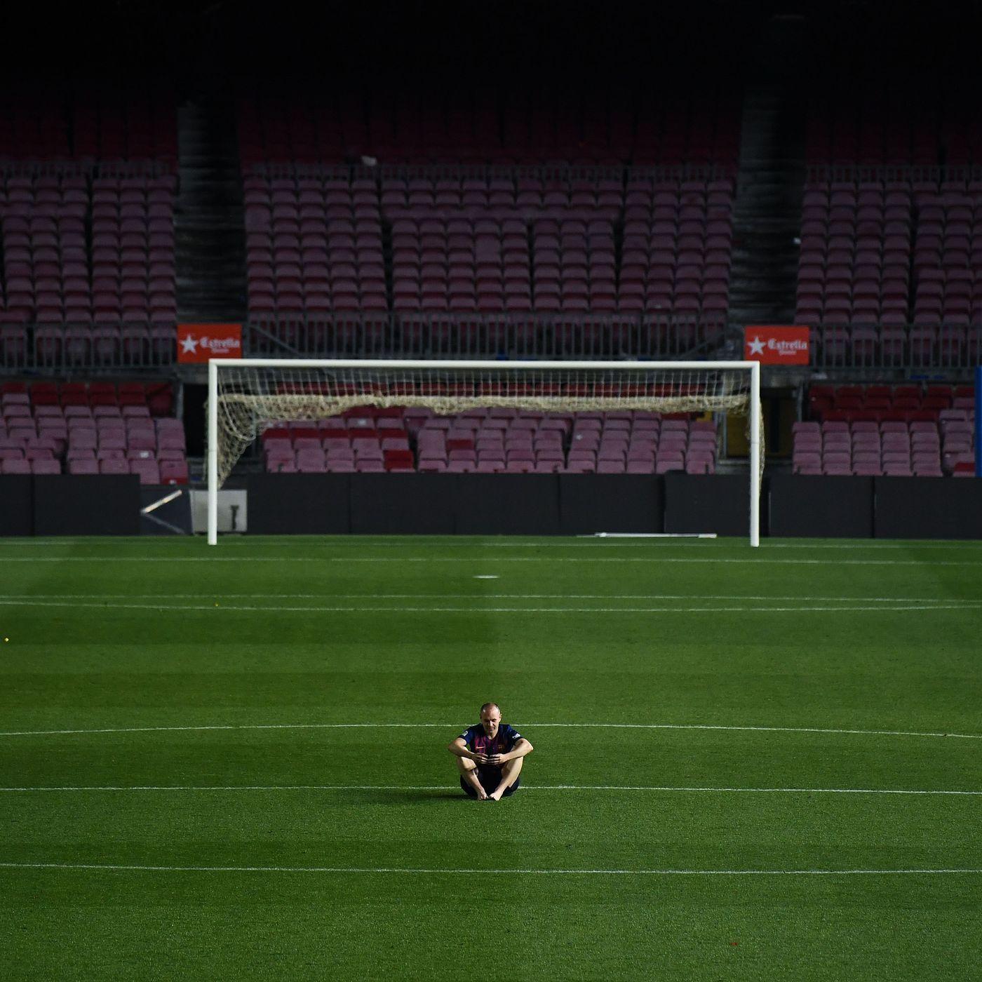 1400x1400 Andres Iniesta sits alone at Camp Nou pitch after final