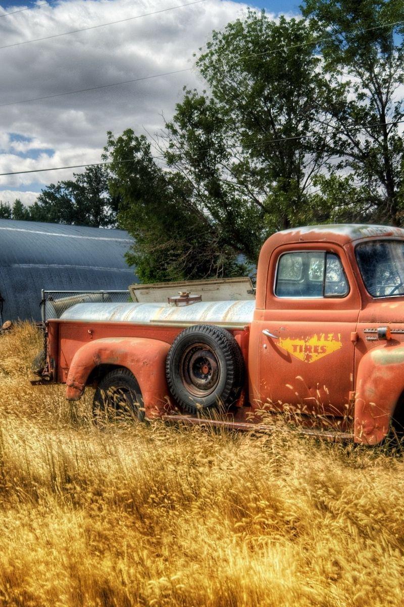 800x1200 Download wallpaper 800x1200 truck, garage, field, farming