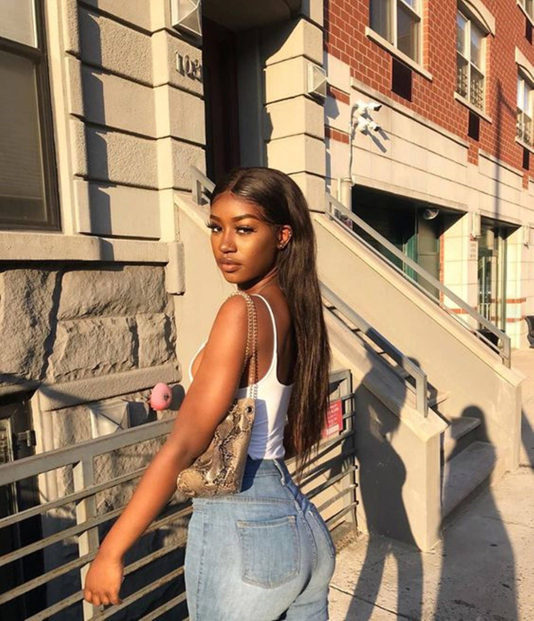 1852x2155 Download Beautiful Black Woman Wearing A Flattering Pair Of Pants Wallpaper