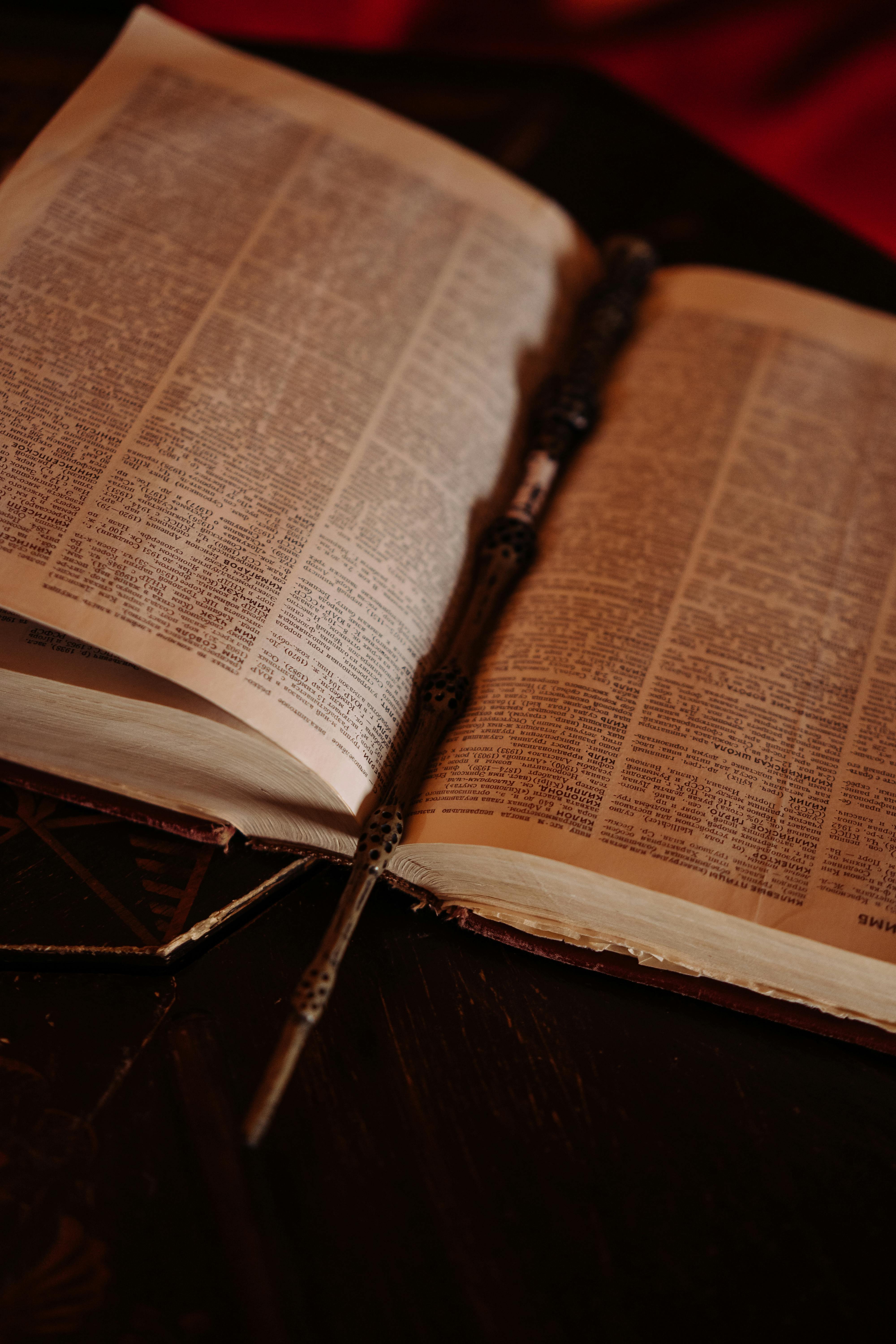 4000x6000 Magic Wand on an Open Spell Book · Free