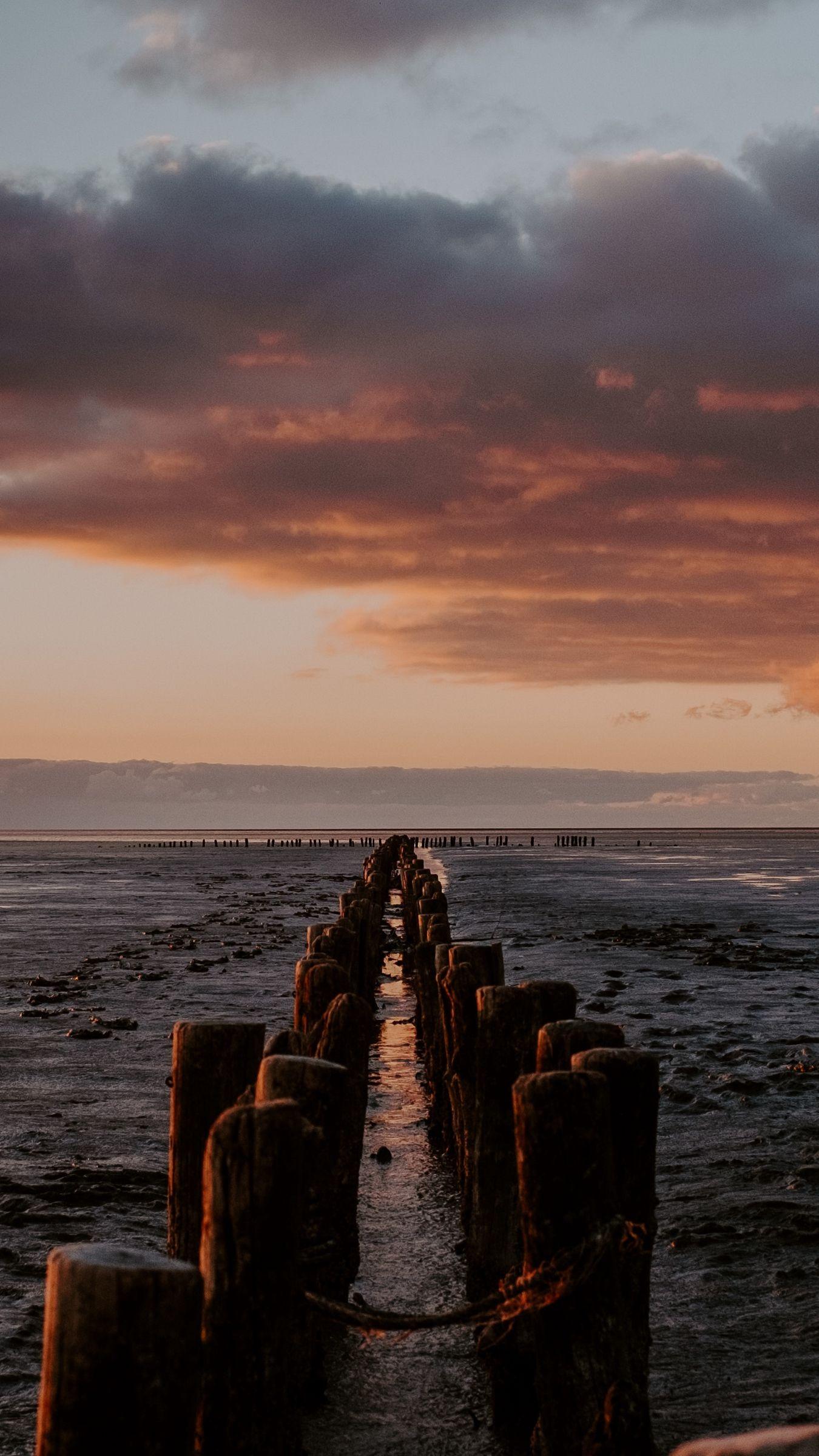 1350x2400 Download wallpaper 1350x2400 ocean, sunset, horizon, pier