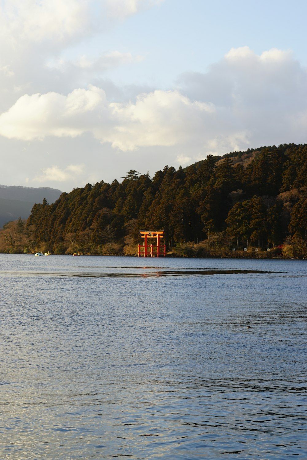 1000x1500 A body of water with a boat in