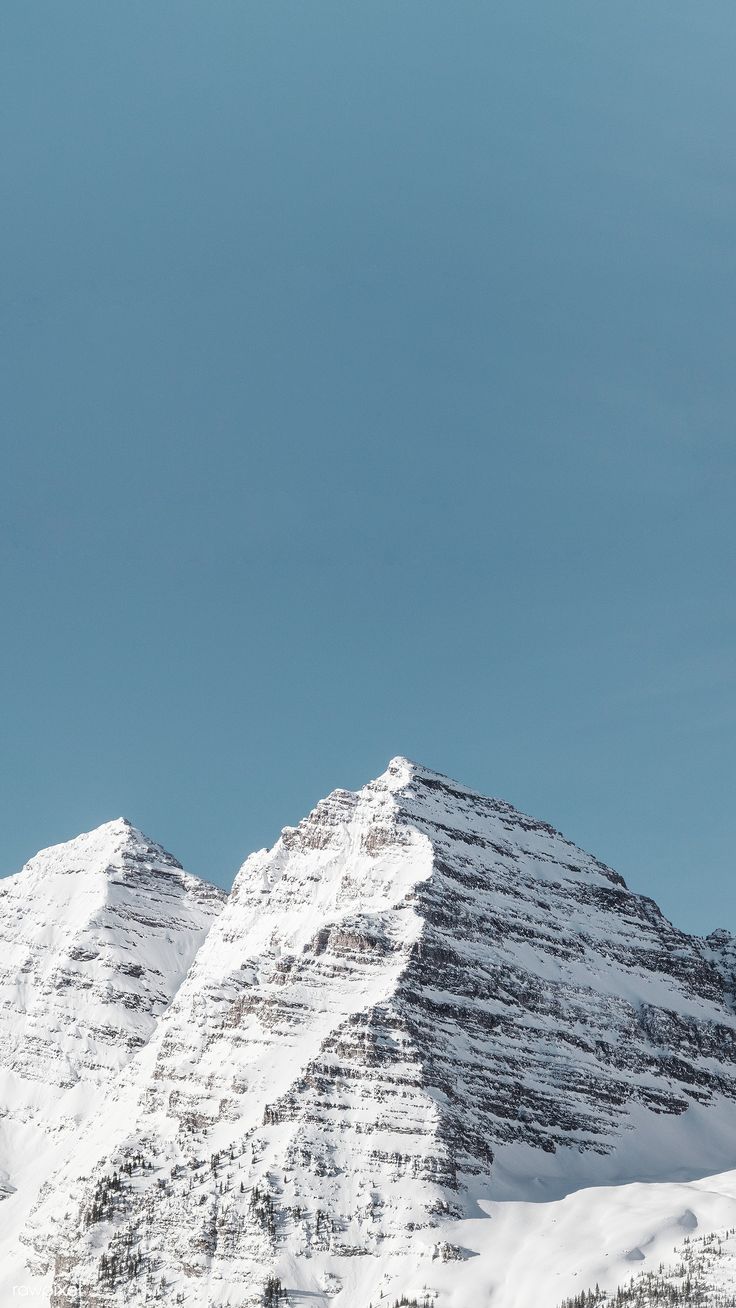736x1308 image of Snow covered Maroon Bells