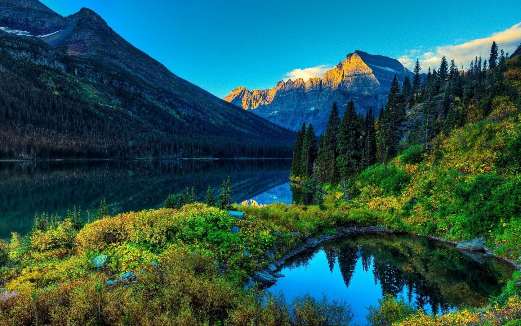 1680x1050 Download wallpaper 1680x1050 mountain, river, grass, trees