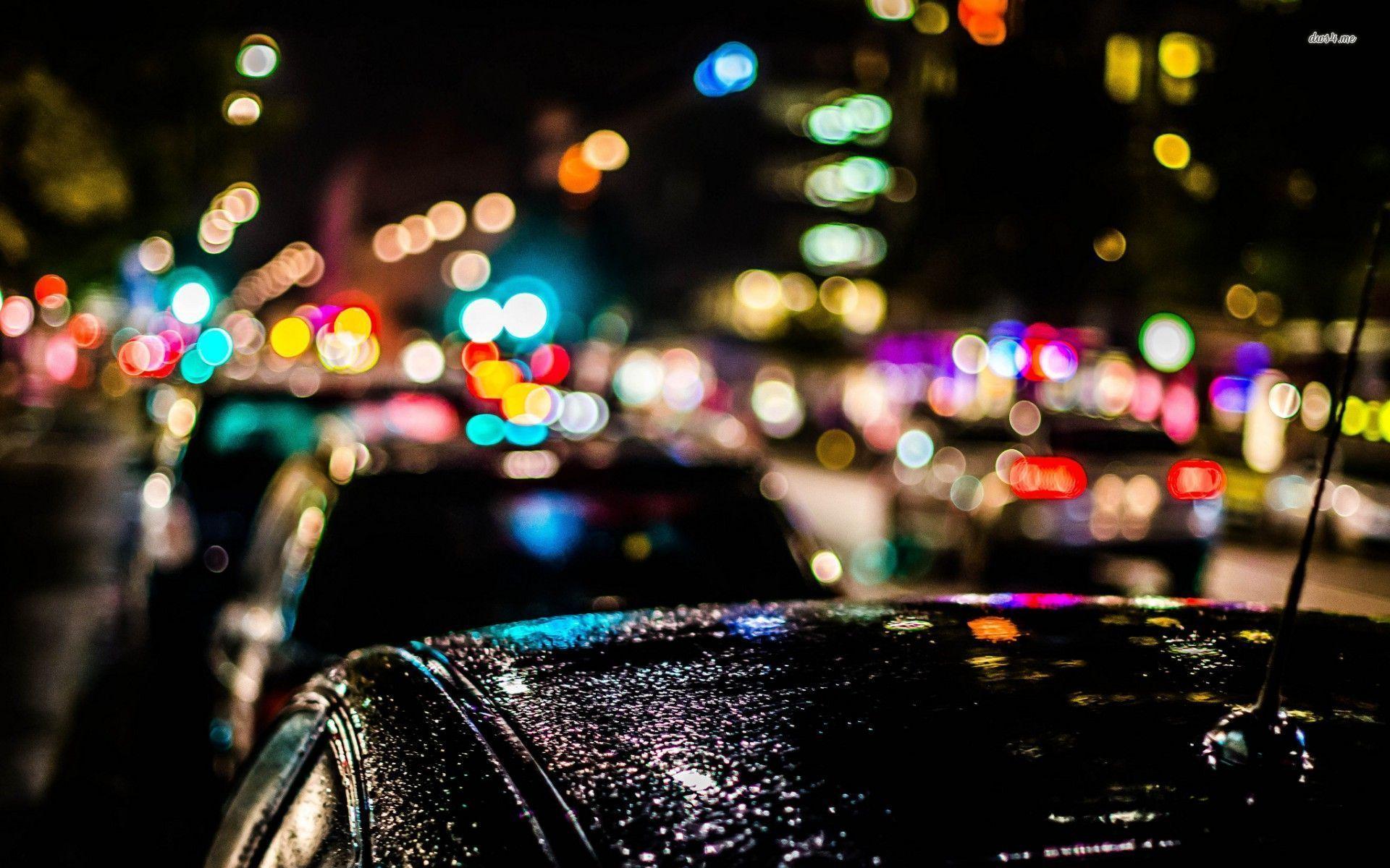 1920x1200 Blurred city lights over the cars wallpaper
