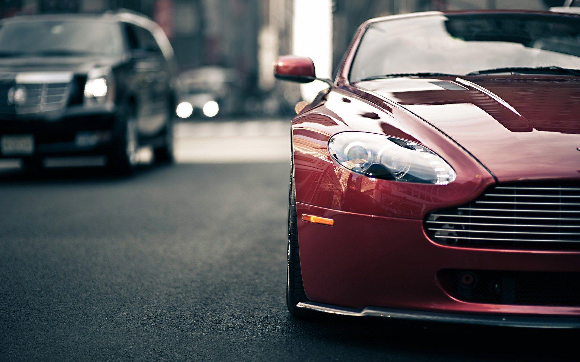 1920x1200 Aston Martin V8 And Cadillac Escalade Vantage Traffic Desktop Wallpaper