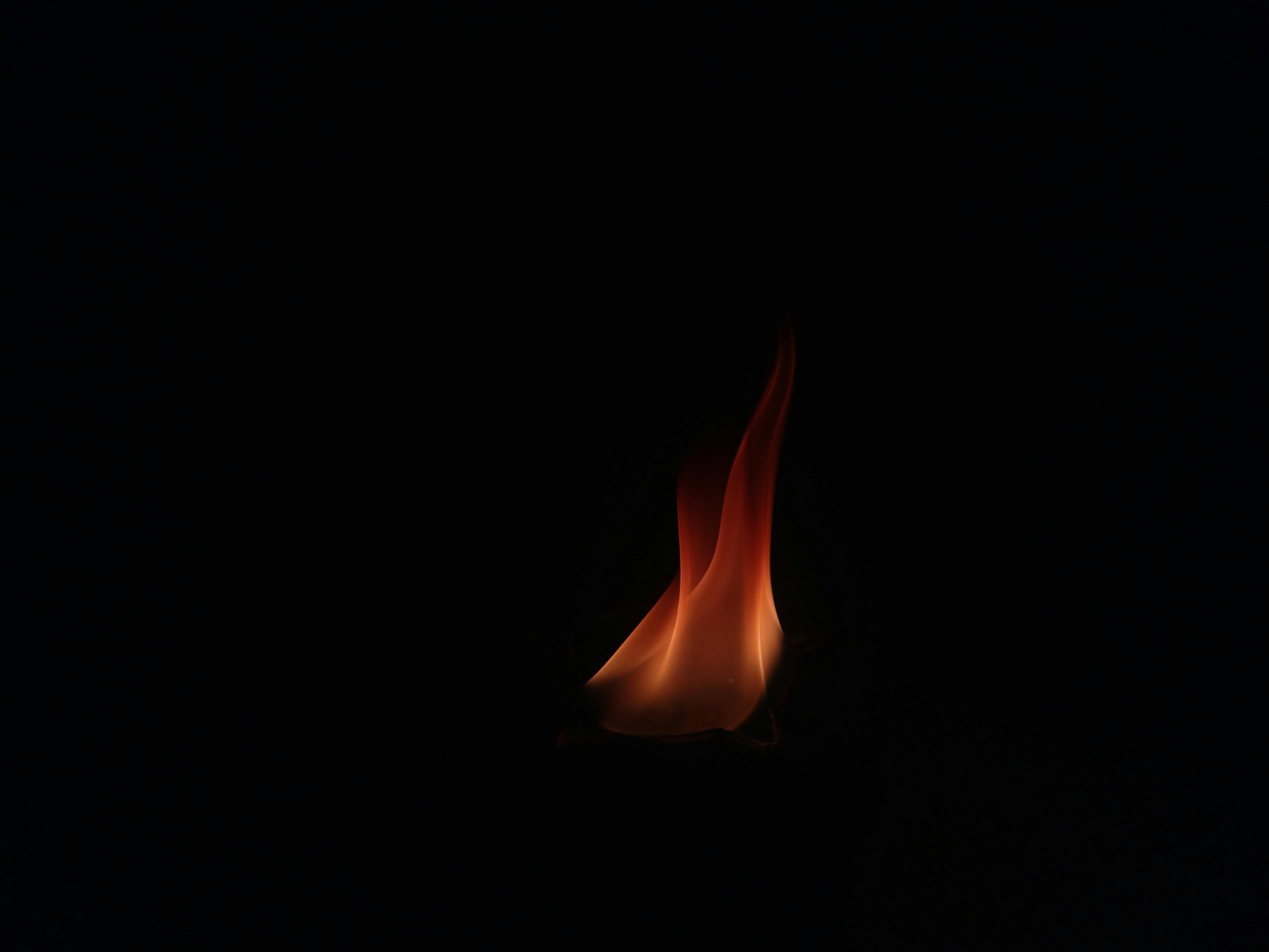 4032x3024 A Burning Flame in a Dark Background