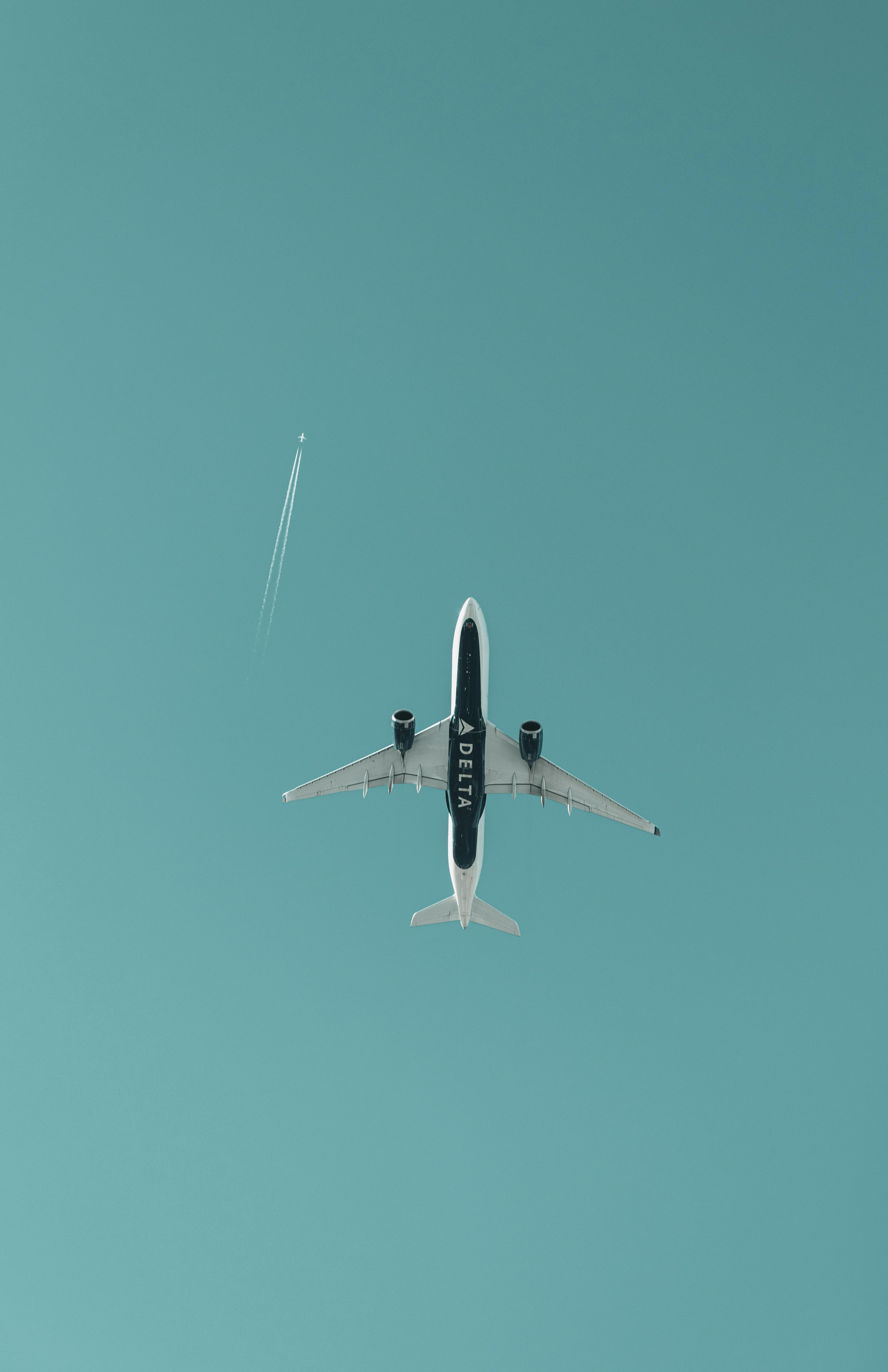 3406x5261 White and Black Airplane in Mid Air