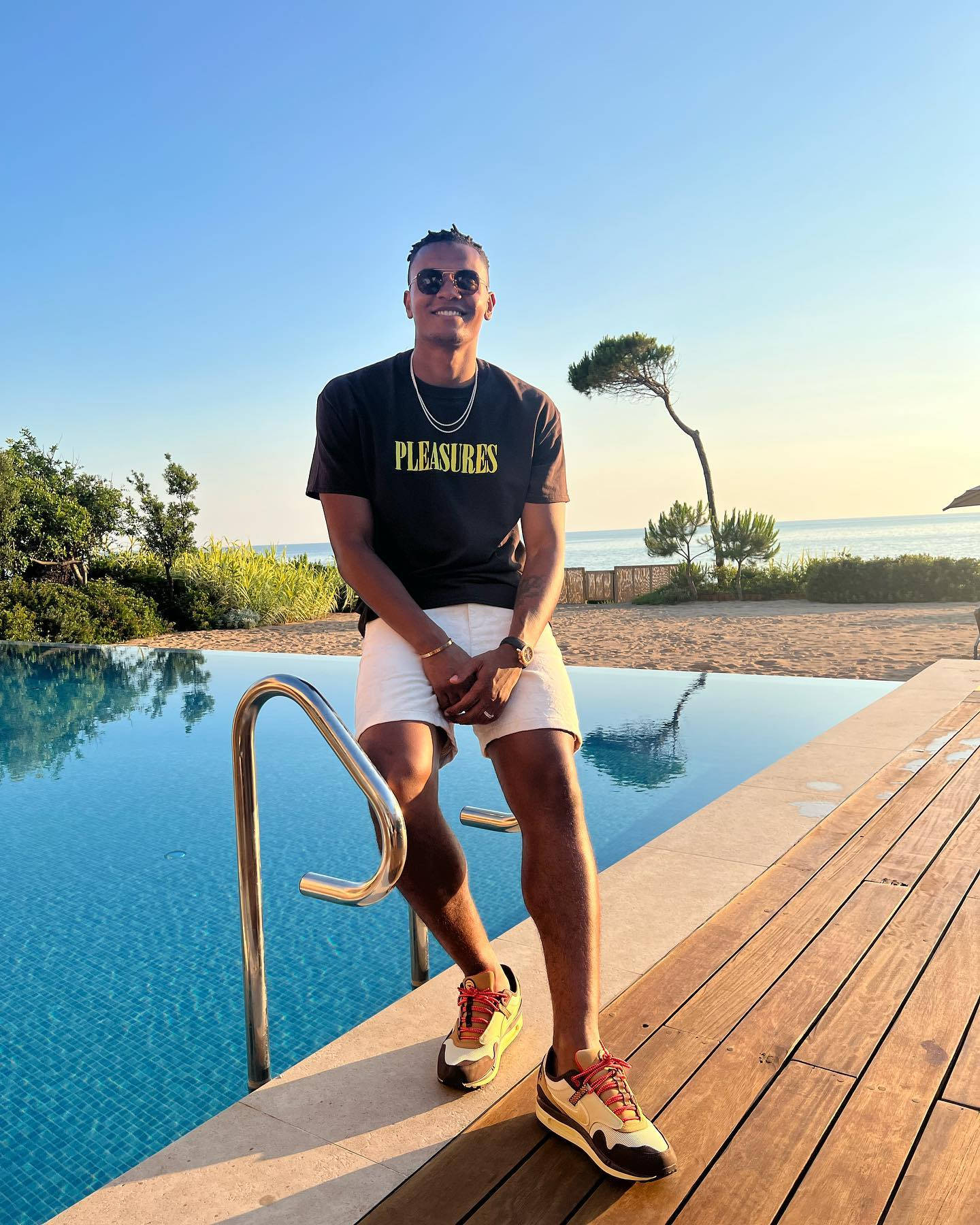 1440x1800 Manuel Akanji By The Pool Wallpaper