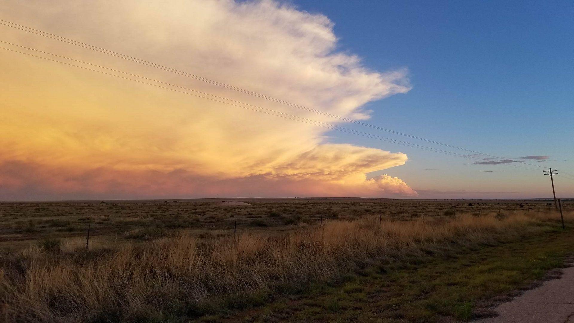 1920x1080 Distant hailstorm at sunset over the New Mexico