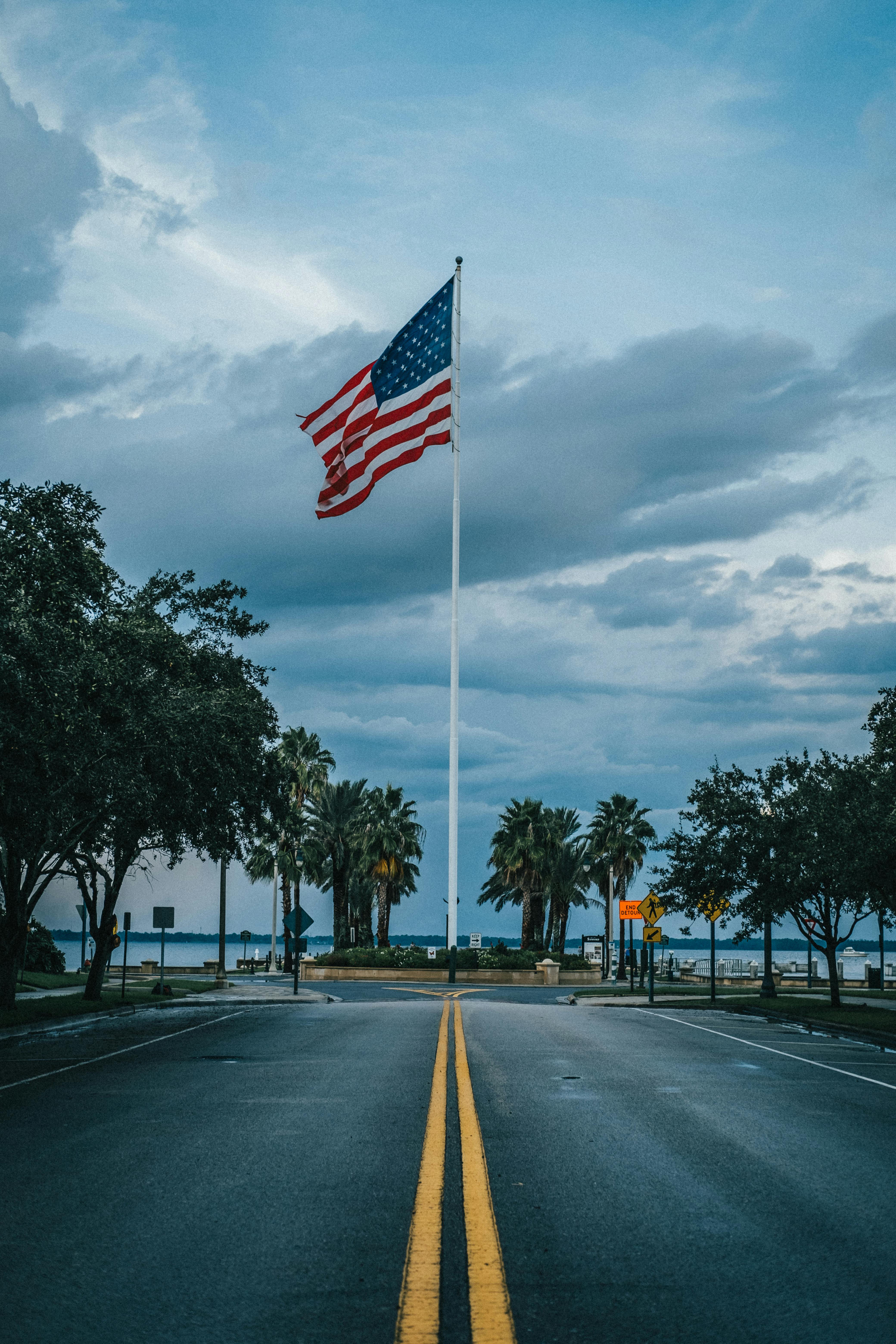 4160x6240 Us Flag on a Pole standing Between