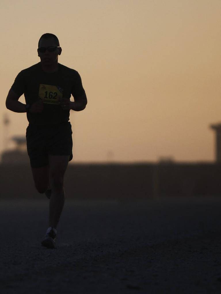 768x1024 Solo Man Athlete In Marathon Wallpaper