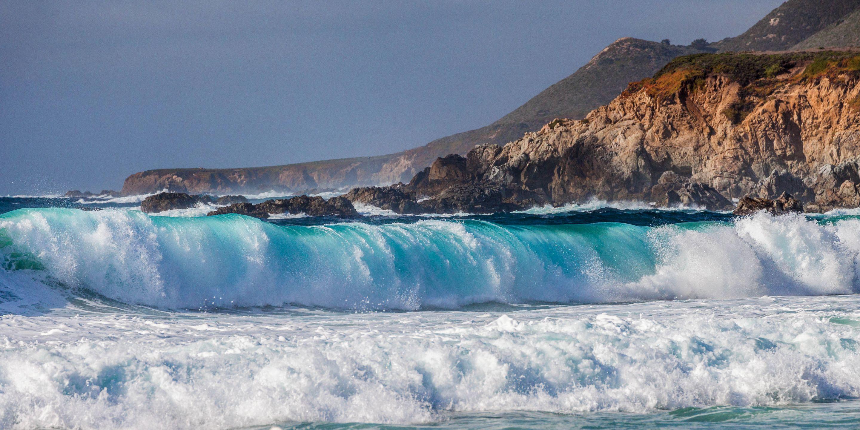 2880x1440 Download wallpaper 2880x1440 sea, surf, spray, rocks HD background