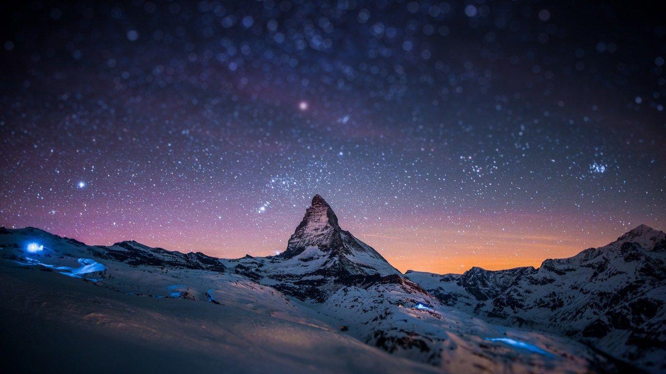 1366x768 Download HD Mountains Night Sky Blurred Stars Light Show Wallpaper