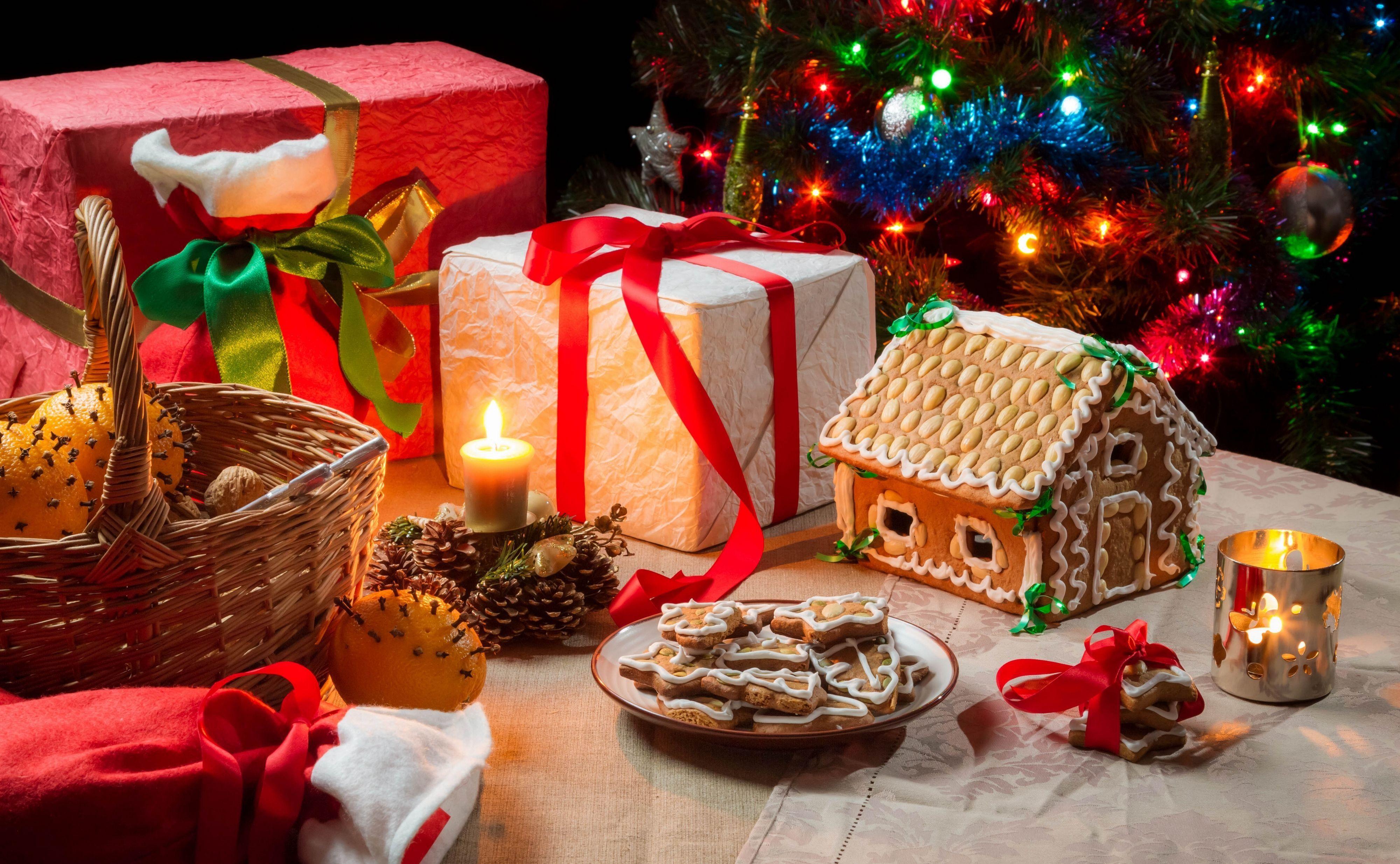 4000x2468 New Year gifts candles cookies gingerbread house basket oranges christmas wallpaperx2468