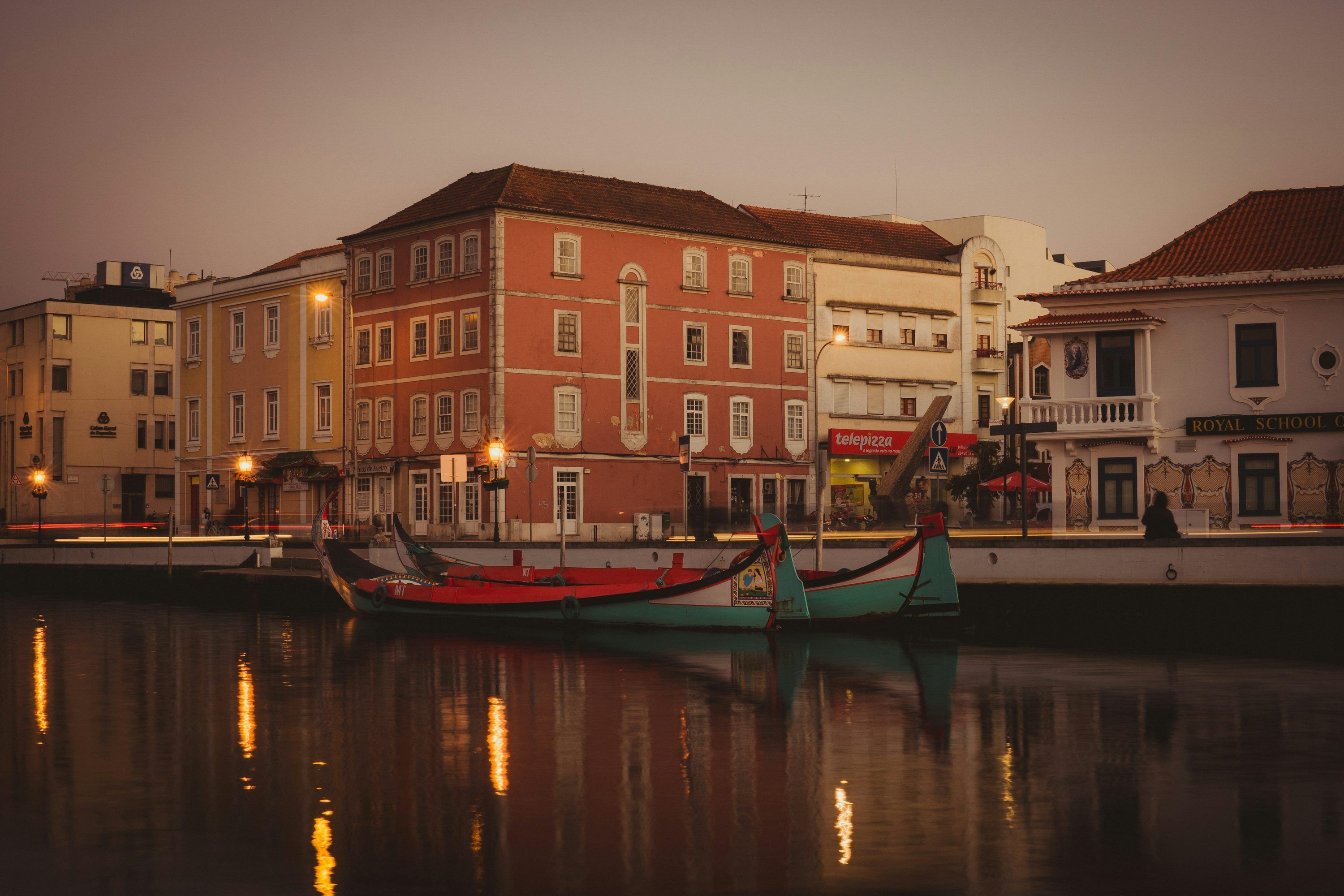 3000x2000 Teal and red boat on river under gray