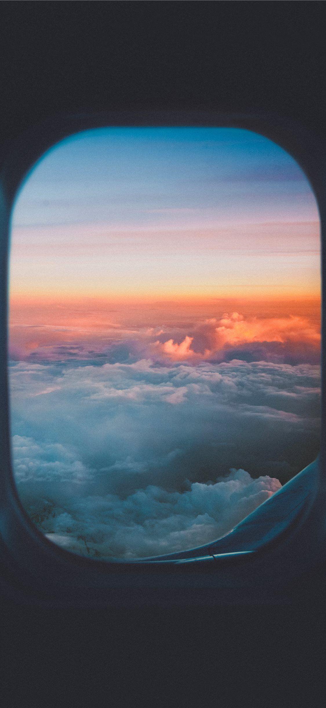 1125x2436 Take me to the sky #sunset #lost #cloud #plane #moment