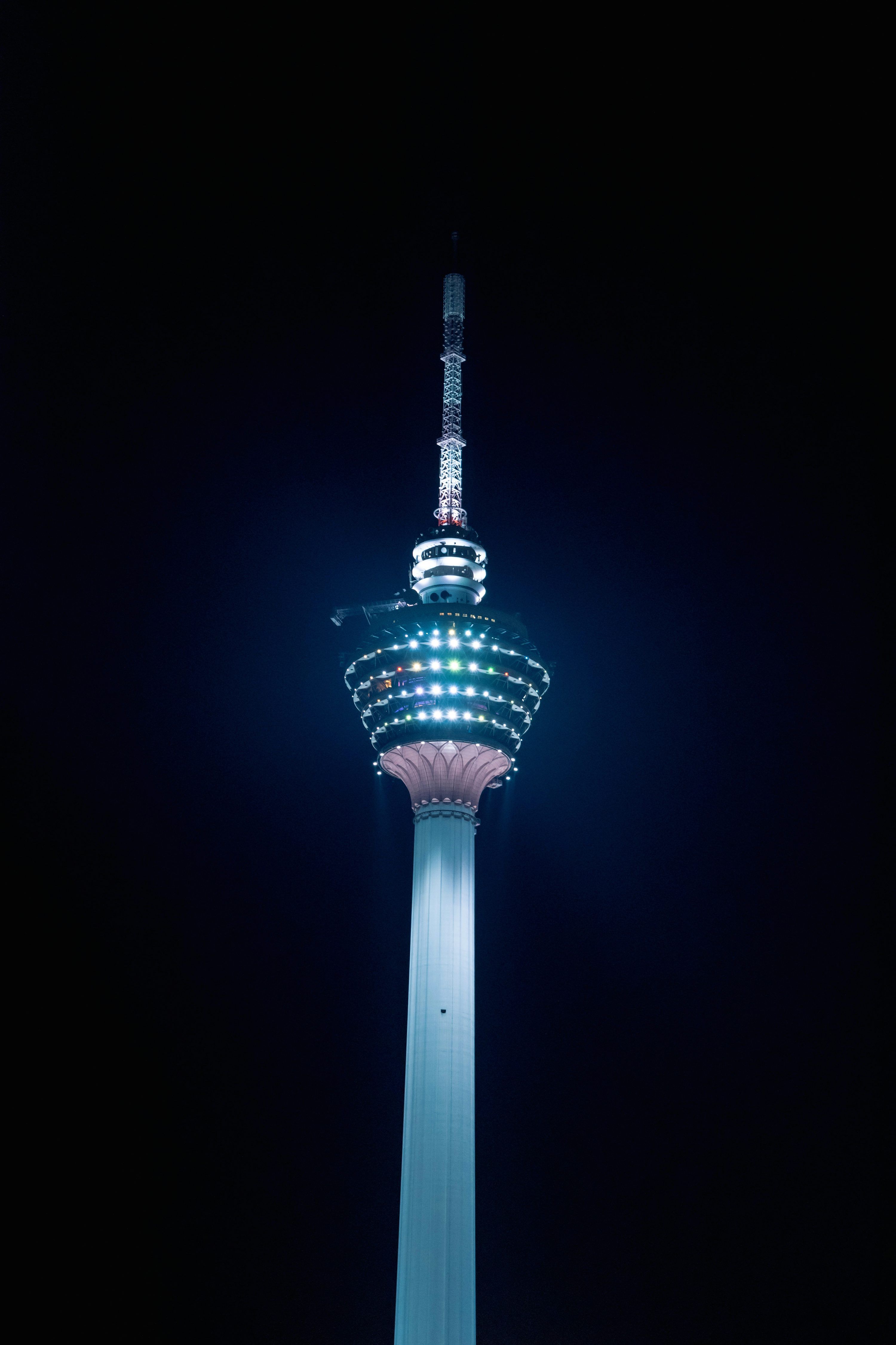 3000x4500 Teal and red tower during night time