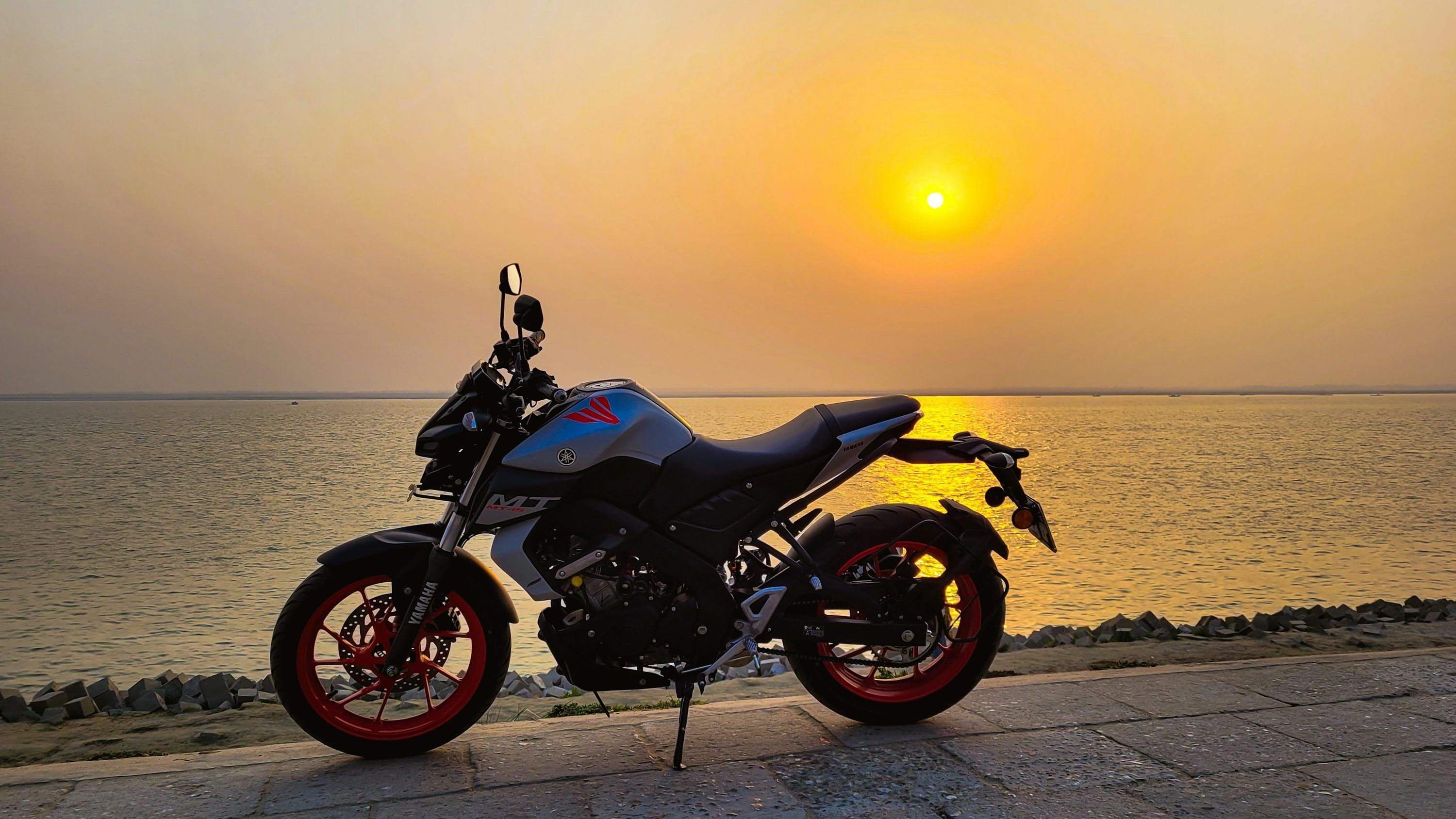3000x1688 red motorcycle on beach during sunset