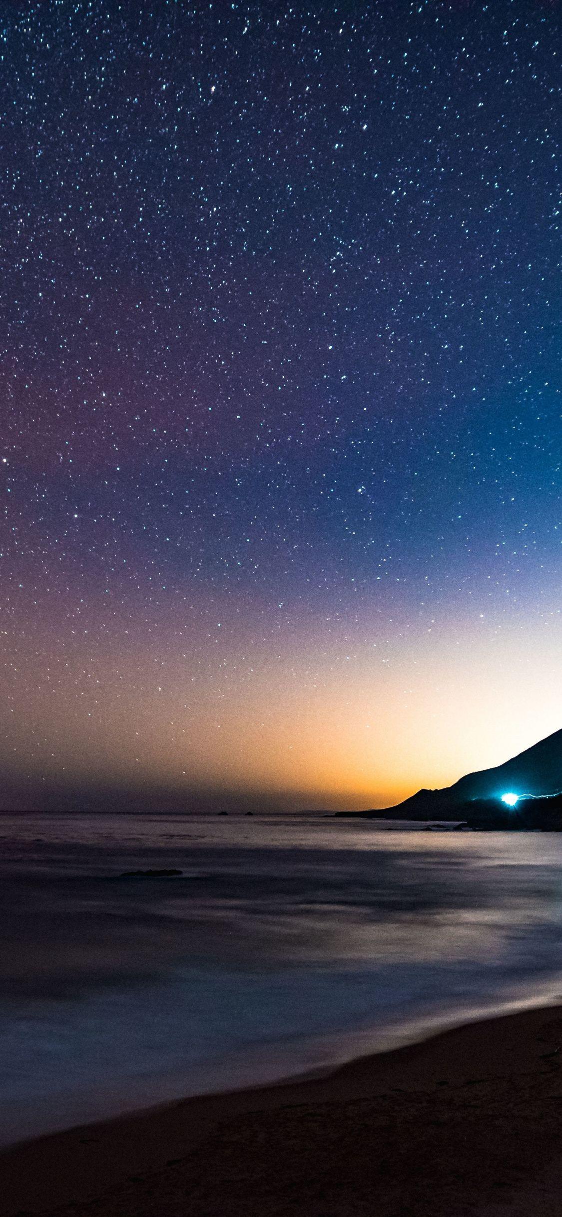 1125x2436 Download 1125x2436 wallpaper coast, colorful sky, sea, stars