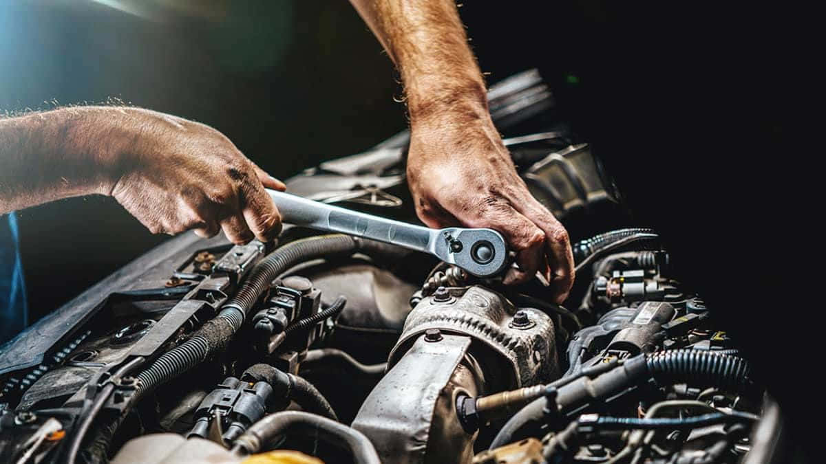 1200x675 Download “A Mechanic Examining a Vehicle Engine”